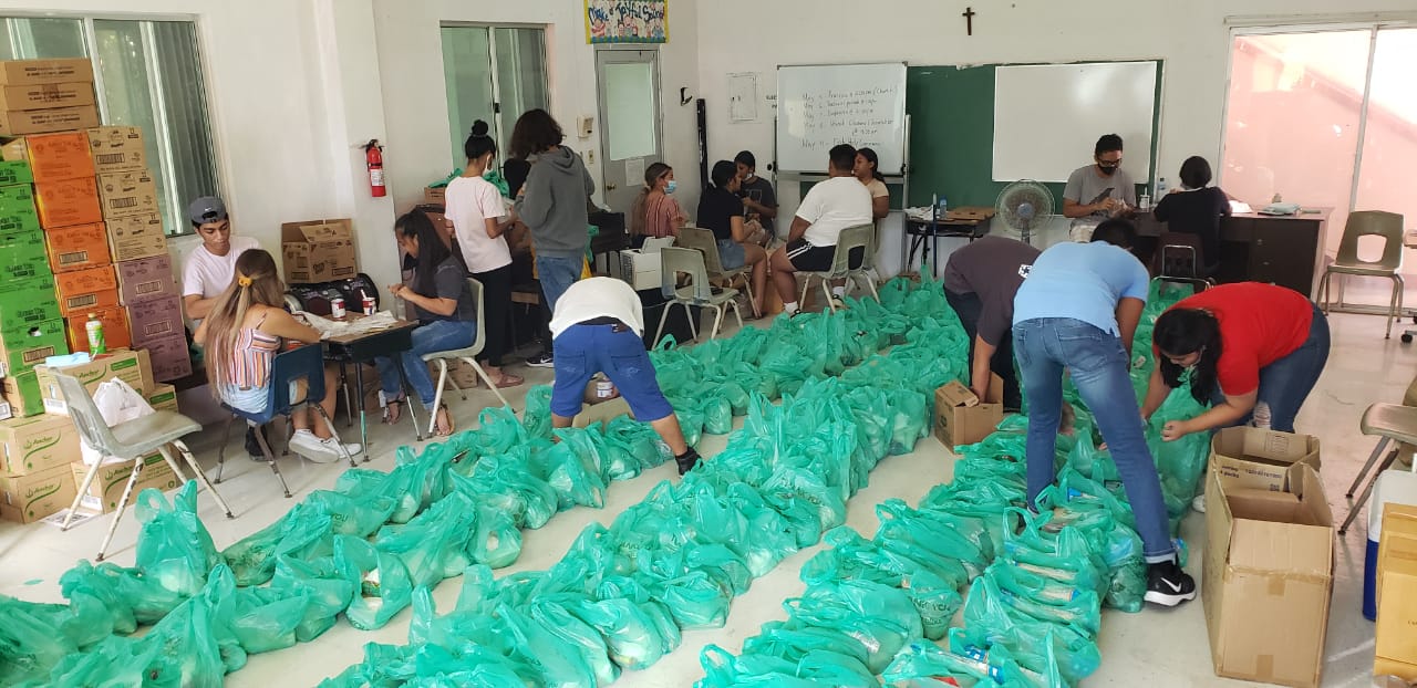 Volunteers prepare the food for distribution.