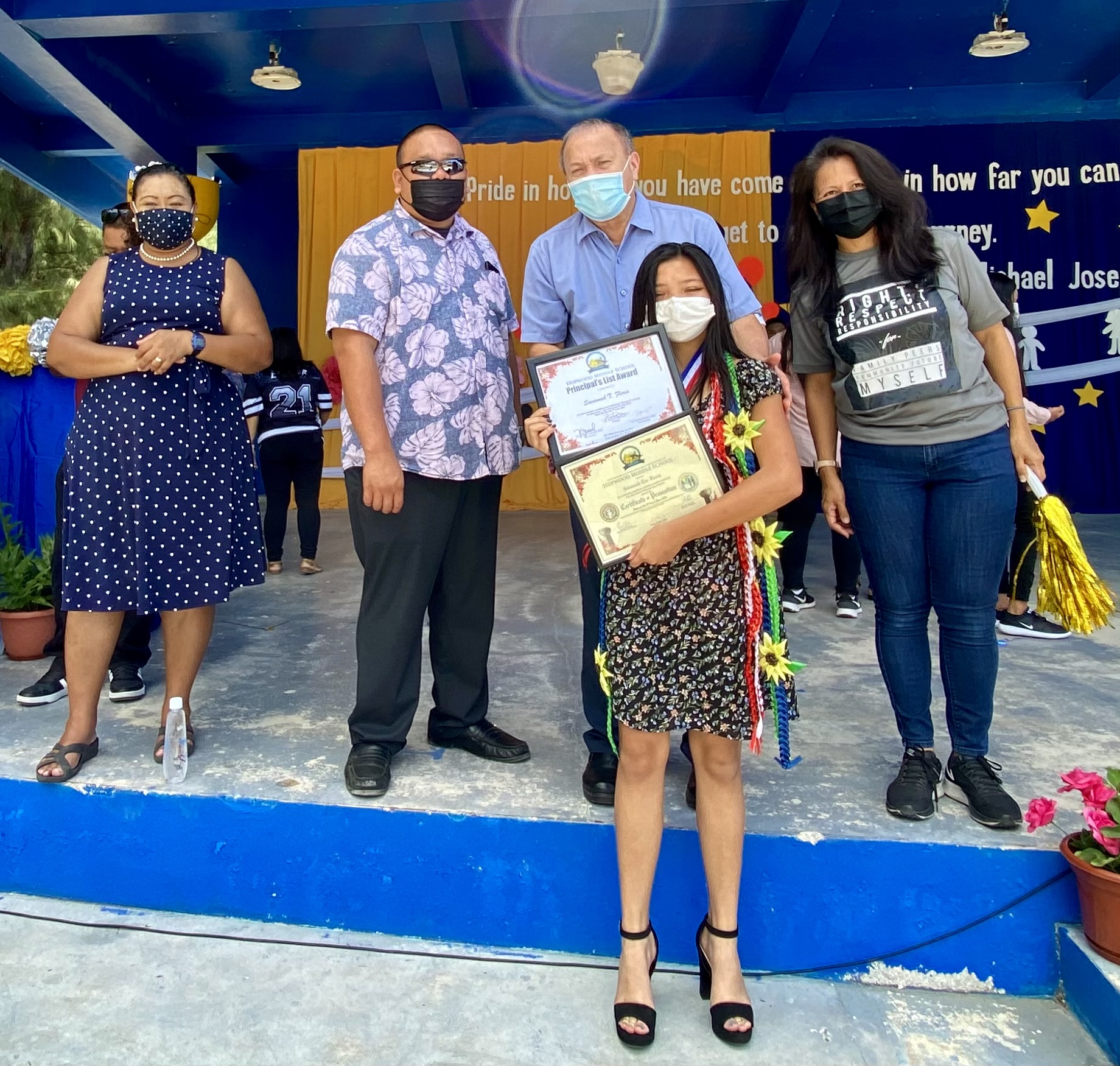 Savannah T. Flores is the recipient of the Presidential Gold Award and Best in  Middle School Leadership Corps. Also in photo are Board of Education Chairman Andrew L. Orsini, BOE member Maisie B. Tenorio, Associate Commissioner Eric Magofna and Francisco M. Sablan Middle School principal Cherlyn Cabrera Osung.