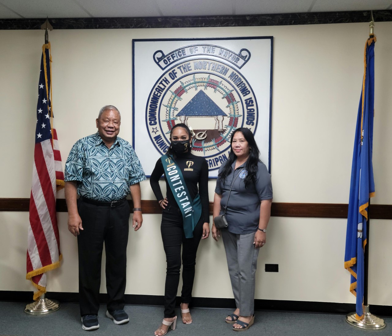 Contestant number one Sue Ann Huevos with Saipan Mayor David M. Apatang and his director of operations Joann Aquino.
