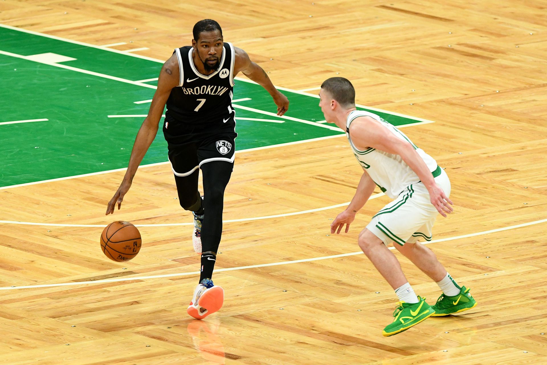 Brooklyn Nets forward Kevin Durant (7) dribbles the ball in front of Boston Celtics guard Payton Pritchard (11) during the second half of game four in the first round of the 2021 NBA Playoffs at TD Garden in Boston, Massachusetts,  Sunday.Photo by Brian Fluharty-USA TODAY Sports
