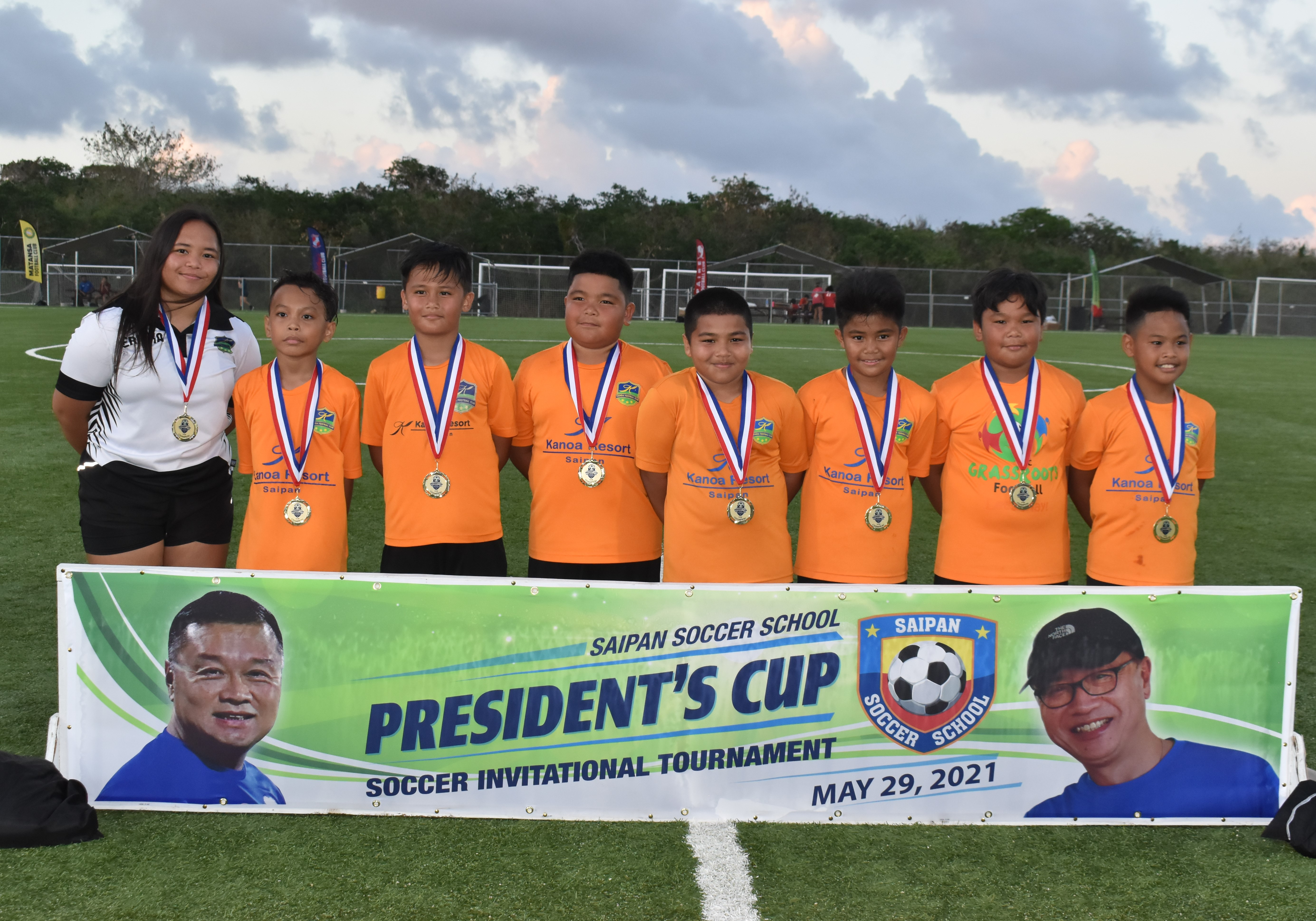 The U10 Kanoa Football Club members pose for a photo wearing their first place medals after winning the President's Cup tournament at the NMI Soccer Training Center on Saturday