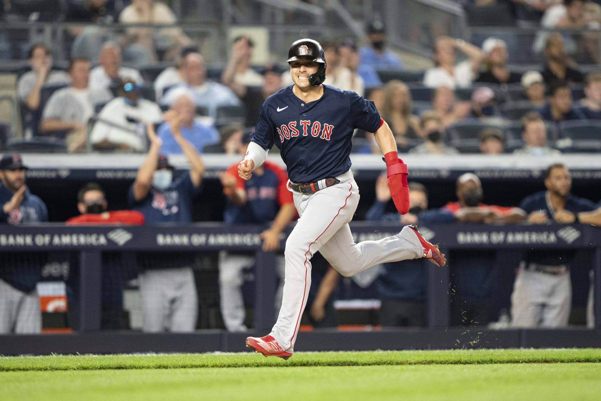 Boston Red Sox center fielder Enrique Hernandez (5) scores a run on Boston Red Sox catcher Christian Vazquez (7) (not pictured) RBI double during the eighth inning against the New York Yankees at Yankee Stadium in the Bronx on June 5, 2021.