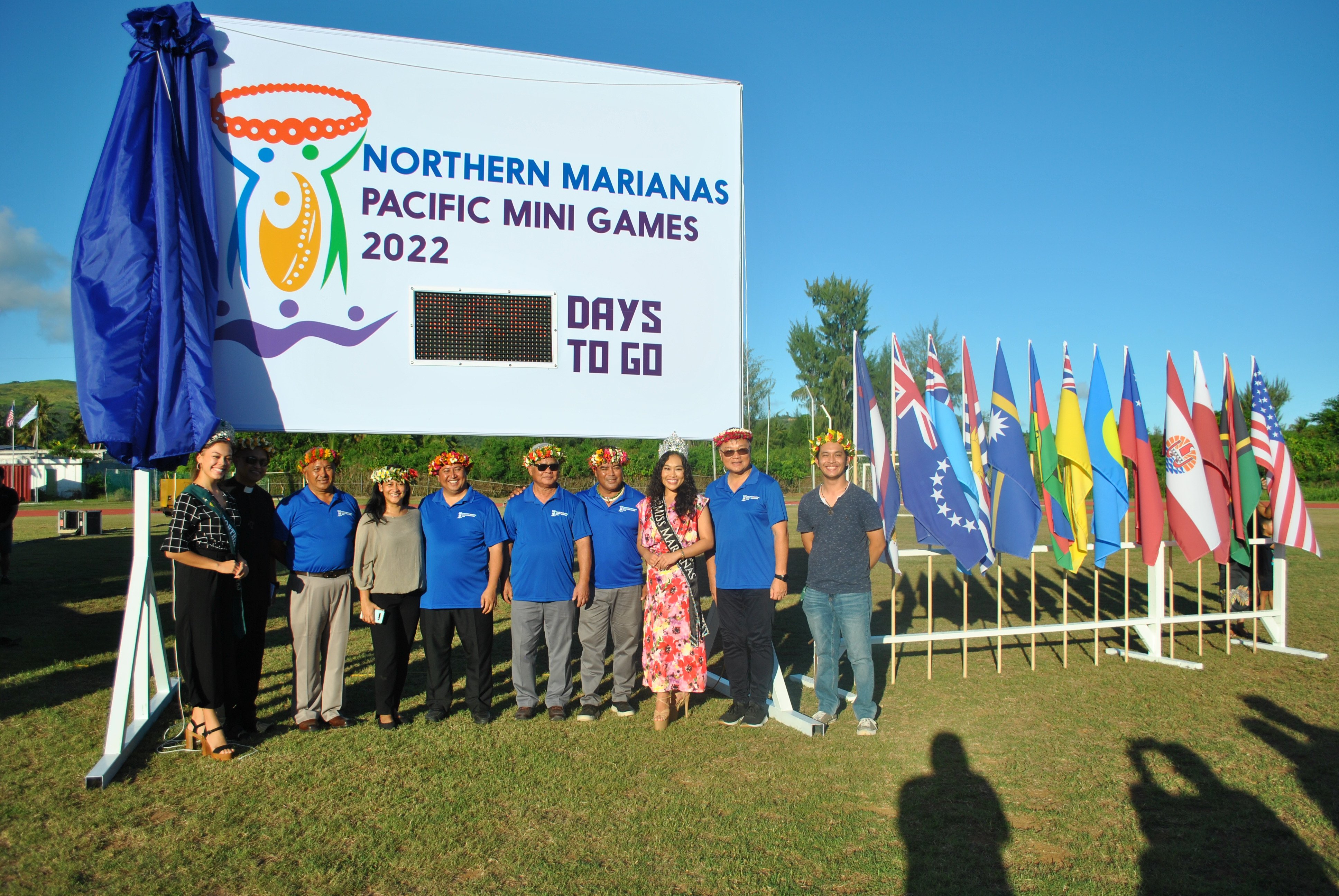 From left, Miss NMI Earth Maria Terlaje, Bishop Ryan Jimenez, NMI Pacific Mini Games CEO Ben Babauta, first lady Diann Torres, Gov. Ralph Torres, Lt. Gov Arnold Palacios,  Pacific Mini Games Committee Chairman Marco Peter, Miss Marianas Savannah Delos Santos, Northern Marianas Sports Association president Jerry Tan and logo competition winner Kadi Camacho pose with the unveiled countdown clock Thursday at the Oleai Sports Complex.
