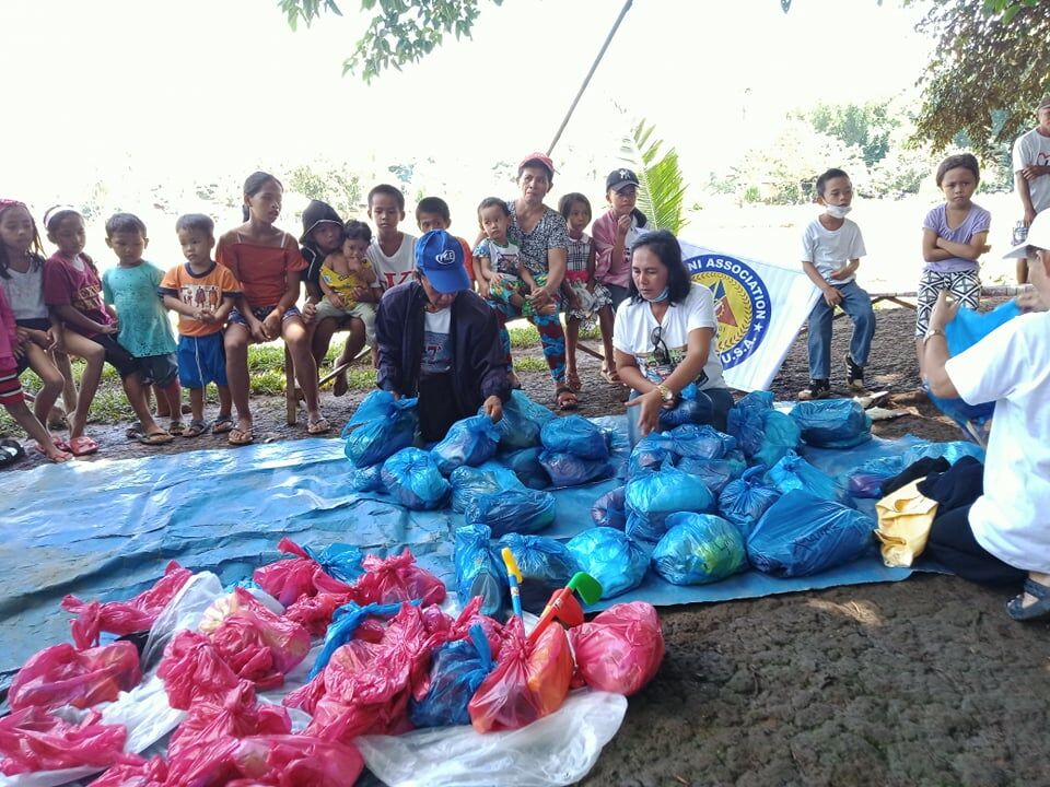 Bayani volunteers sort out the bags of clothes and toys prior to their distribution.