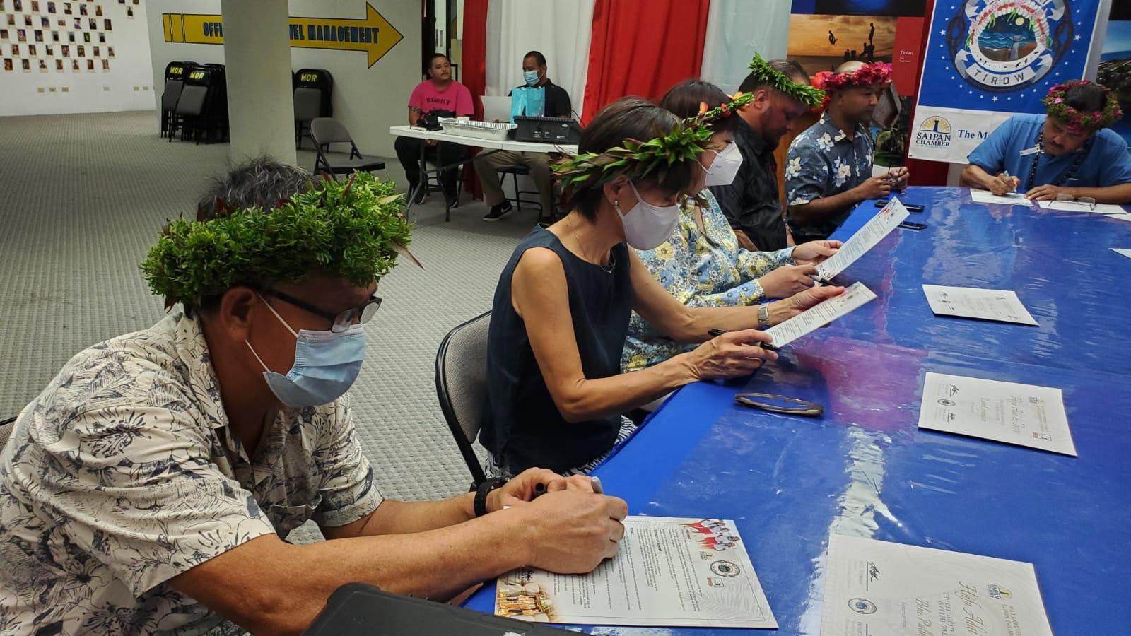 Eight government and business leaders gather at the Rota Mayor’s Office on June 21, 2021, to take the Hafa Adai & Tirow Pledge.