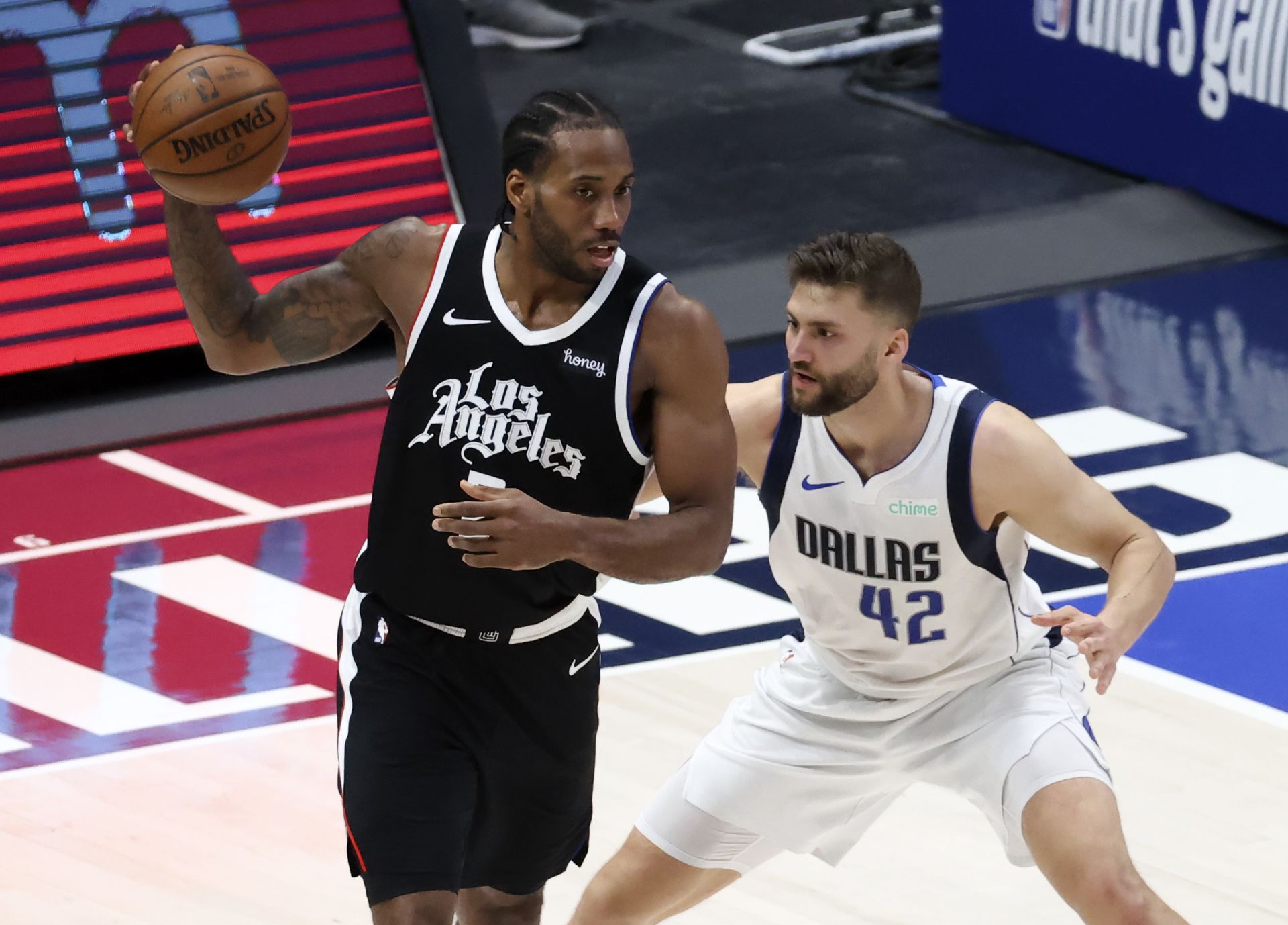 LA Clippers forward Kawhi Leonard (2) looks to score as Dallas Mavericks forward Maxi Kleber (42) defends during the second quarter in game four in the first round of the 2021 NBA Playoffs at American Airlines Center  in Dallas, Texas, Sunday.Photo by Kevin Jairaj-USA TODAY Sports