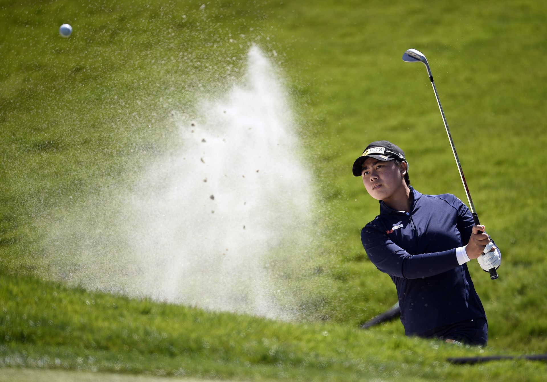 Yuka Saso of the Philippines plays a shot from a bunker on the third hole during the third round of the U.S. Women's Open golf tournament at The Olympic Club in San Francisco, California on June 5, 2021.