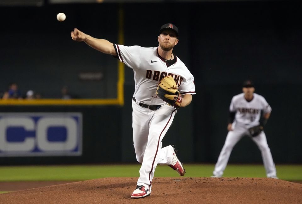 Arizona Diamondbacks starting pitcher Merrill Kelly (29) throws against the Milwaukee Brewers in the first inning at Chase Field in Phoenix, Arizona on June 21, 2021.