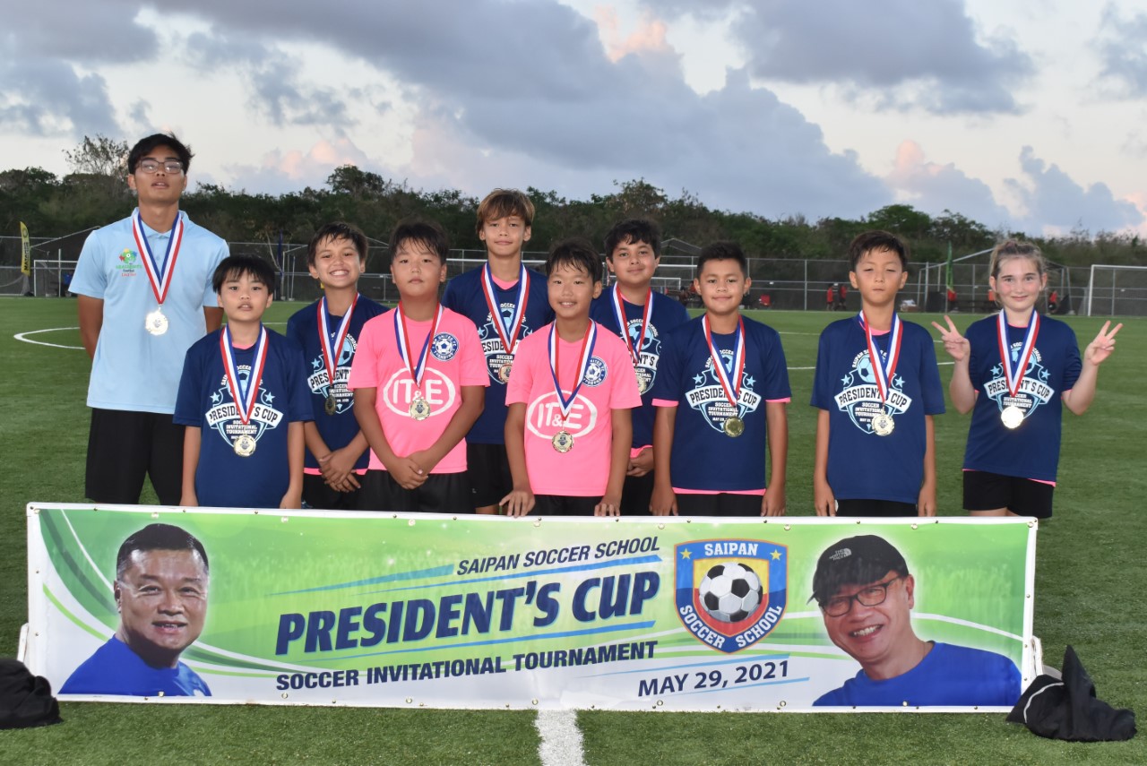 MPU 2 team members pose for a photo with their U12 championship medals.Contributed photo
