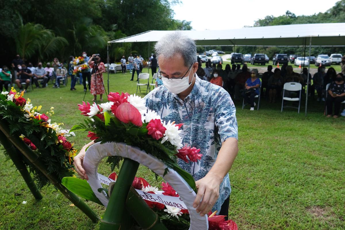 Toshiaki Kobayashi, Japan’s consul-general to Guam, lays a wreath at the Hasso Manenggon Memorial on Monday morning.
