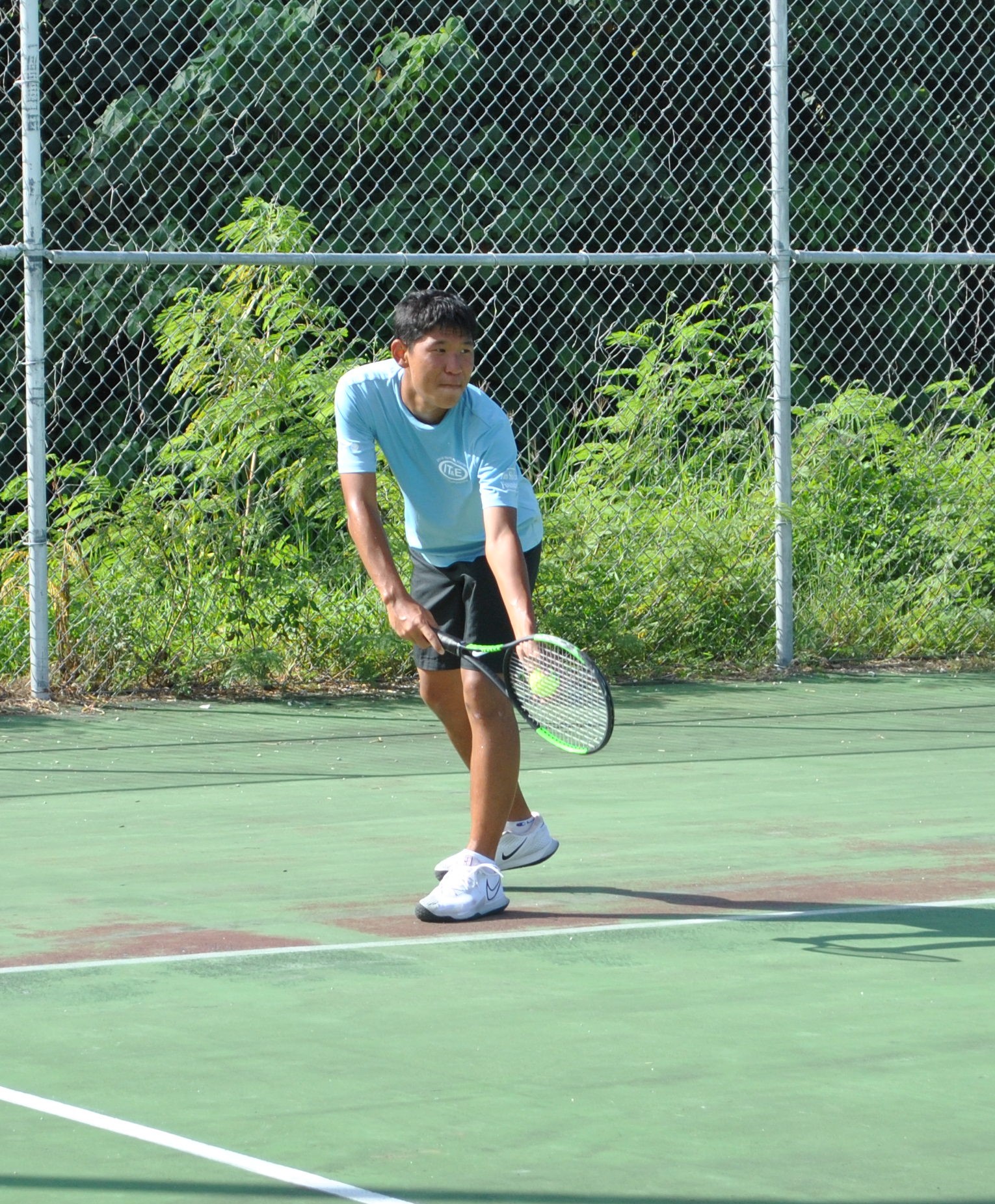 Jun Wang is about to serve.