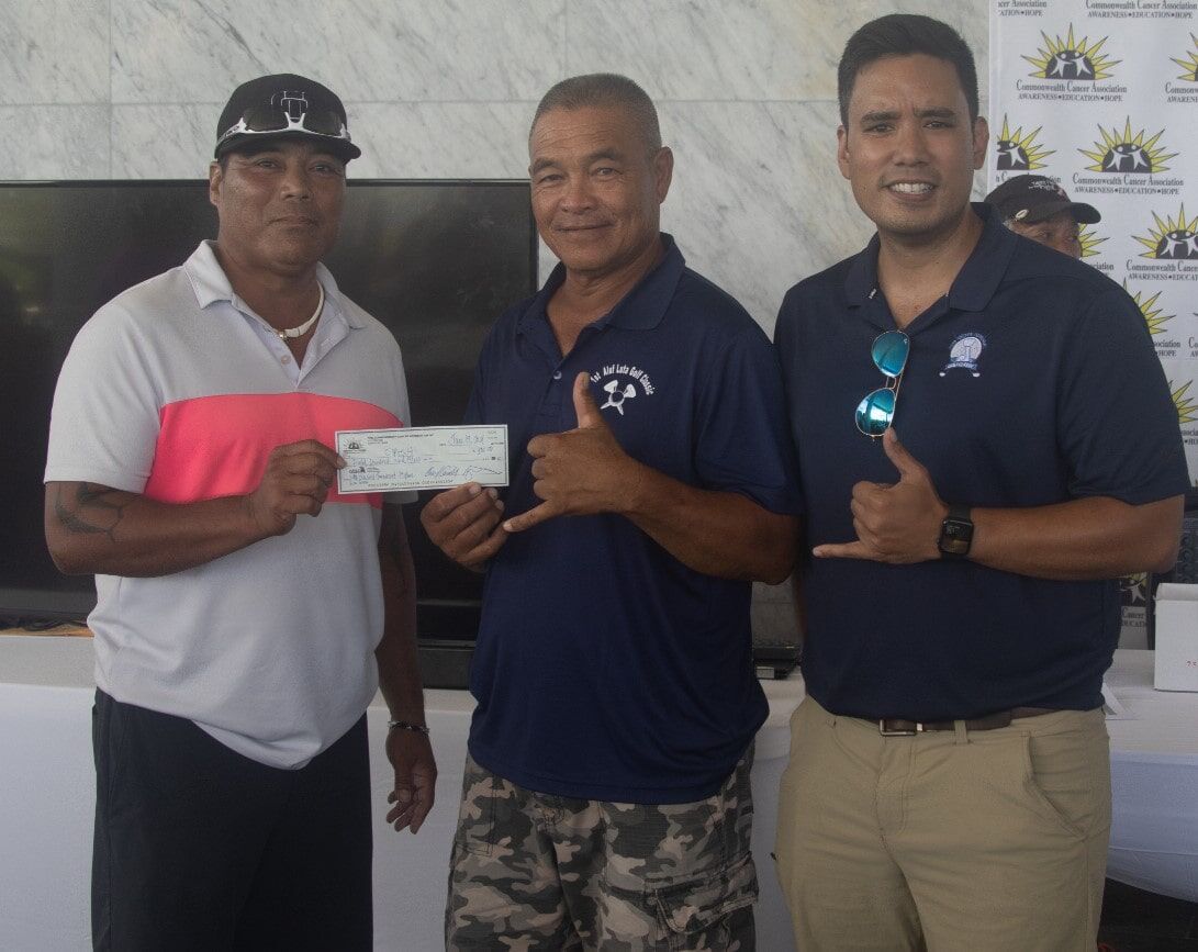 From left, Marco T. Peter and Joe “Kamikaze” Camacho, 1st place Low Gross winner, with  Bo Palacios, CCA board president.