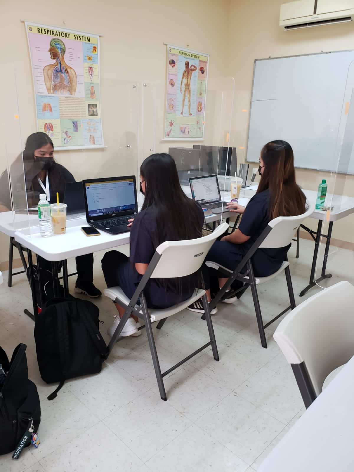 Students attend an online class at the Chalan Laulau location of the Guam Marianas Training Center.
