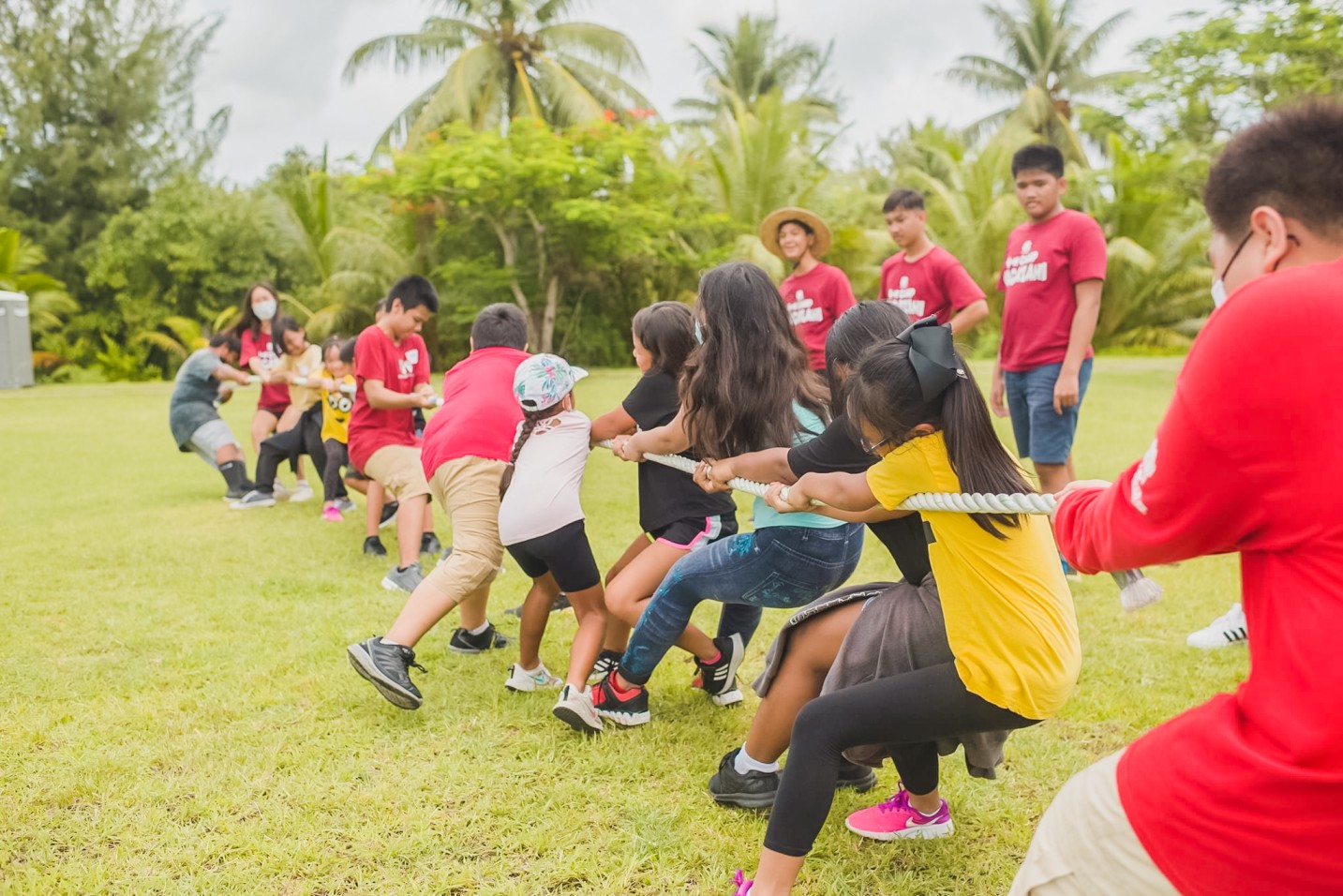 Campers from the House of Kepuha play a game of Tug of War.