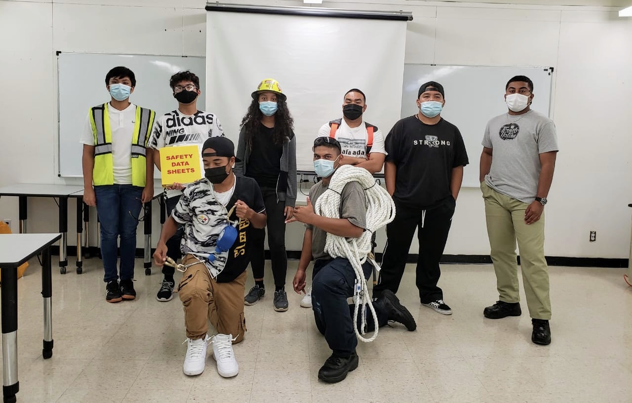 The Construction Boot Camp students pose for a photo following their successful completion of a two-day OSHA training.