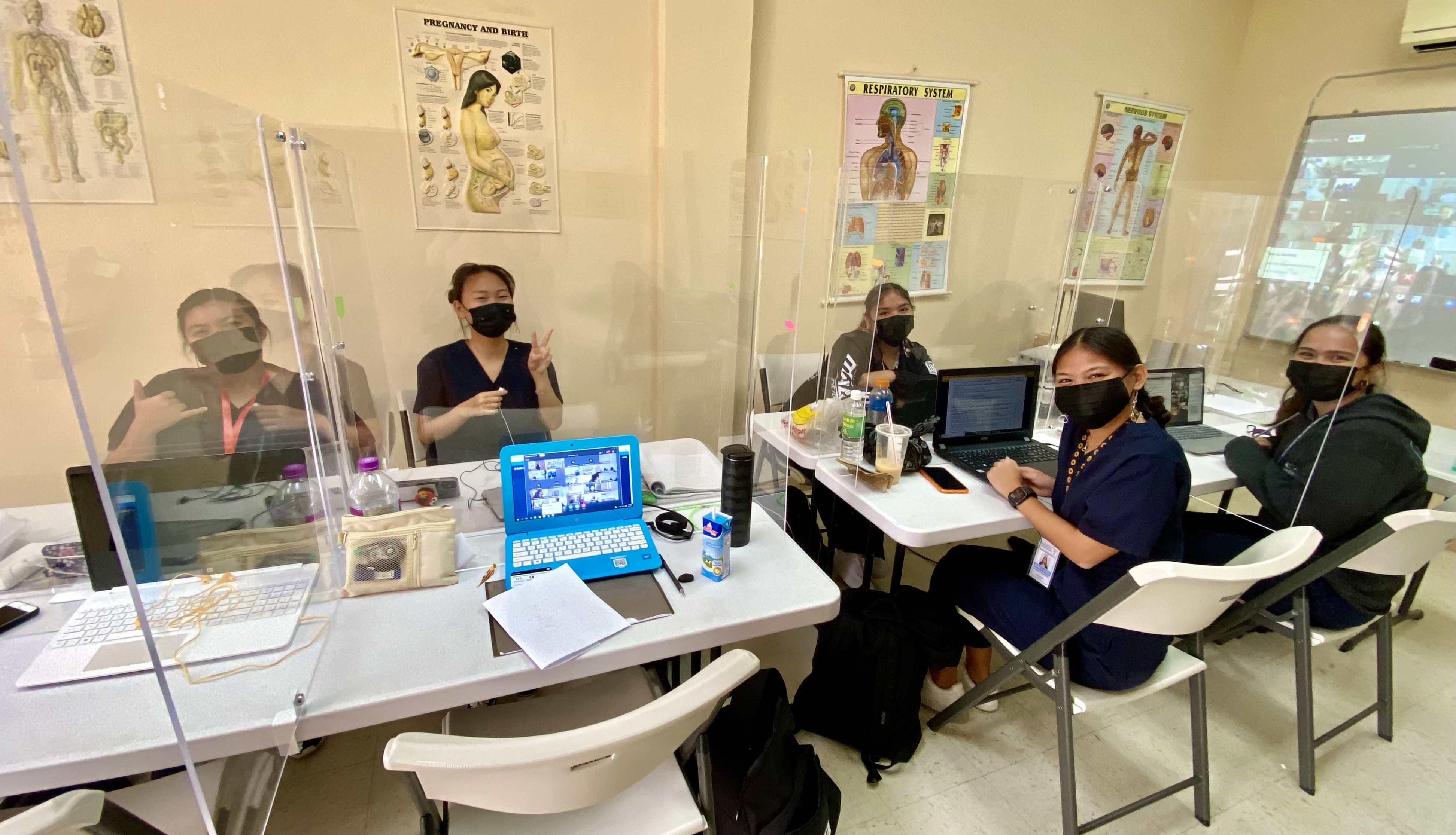 Each classroom has  glass-paneled individual cubicles and complies with other Covid-19 safety rules.