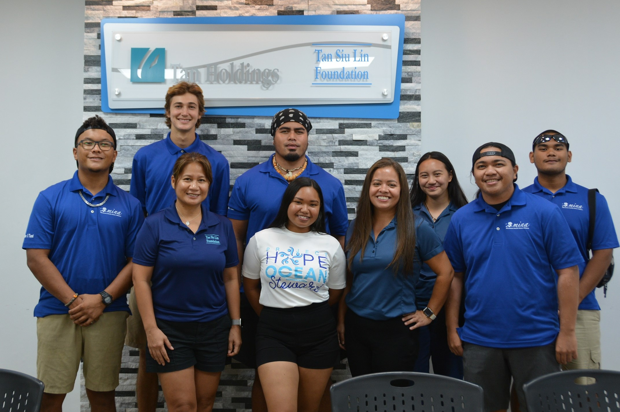 Tasi Watch Rangers join Tan Siu Lin Foundation executive director Merlie Tolentino, front row, second left, for a group photo after receiving a donation Thursday for the Mariana Islands Nature Alliance’s marine debris contest.