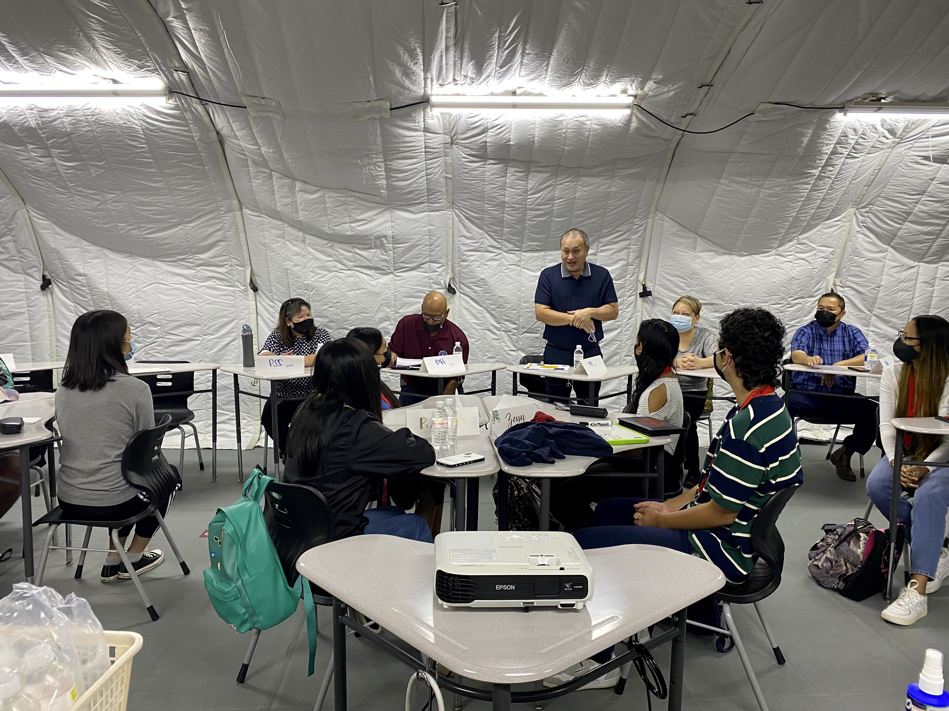 Board of Education Chairman Andrew L. Orsini, center standing, says he is proud of the Teacher Academy Summer Program participants.
