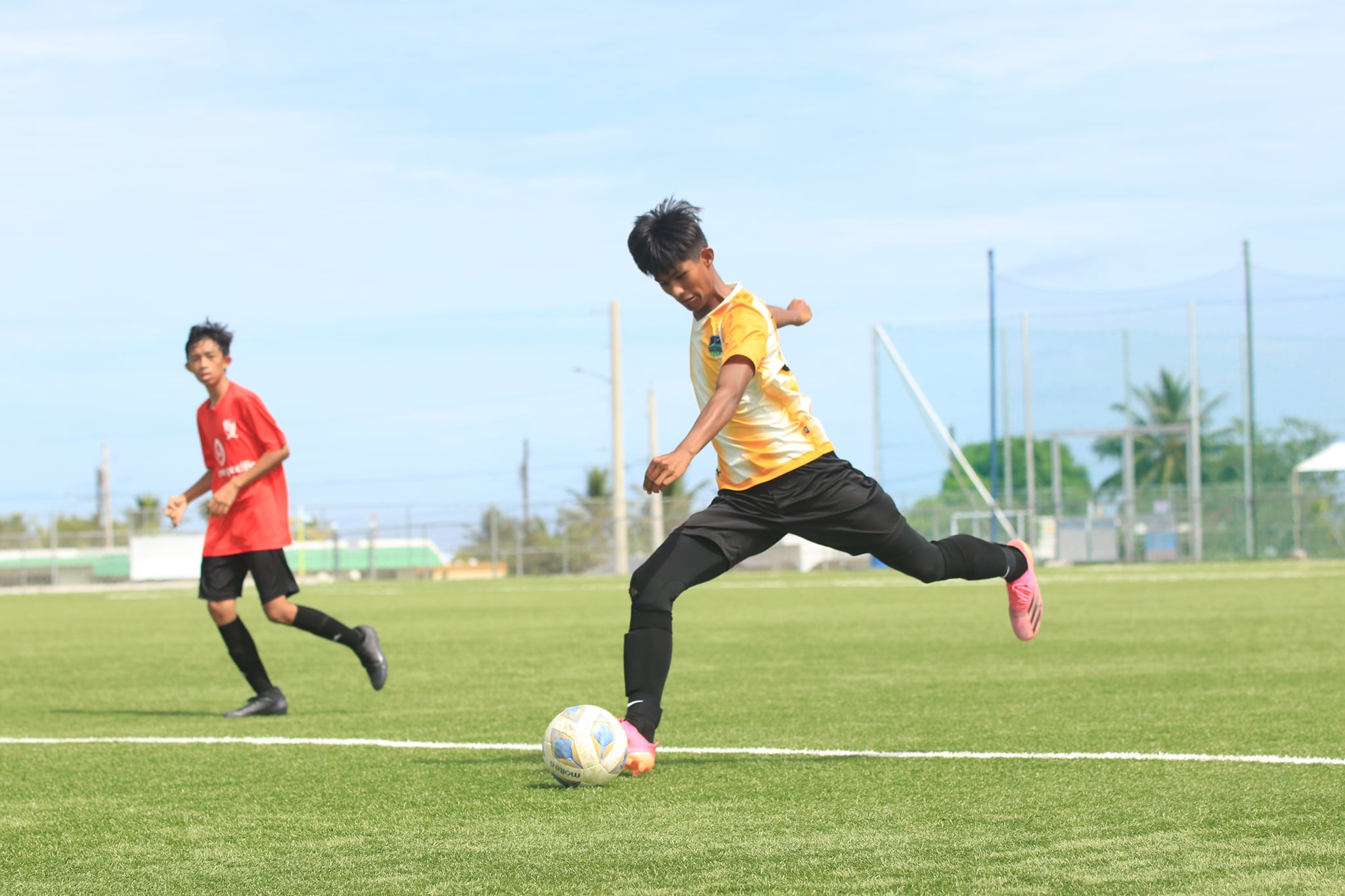 Kanoa’s Markus Toves winds up for the shot during a U15 boys division game of the Summer 2021 Youth League on Saturday at the NMI Soccer Training Center.