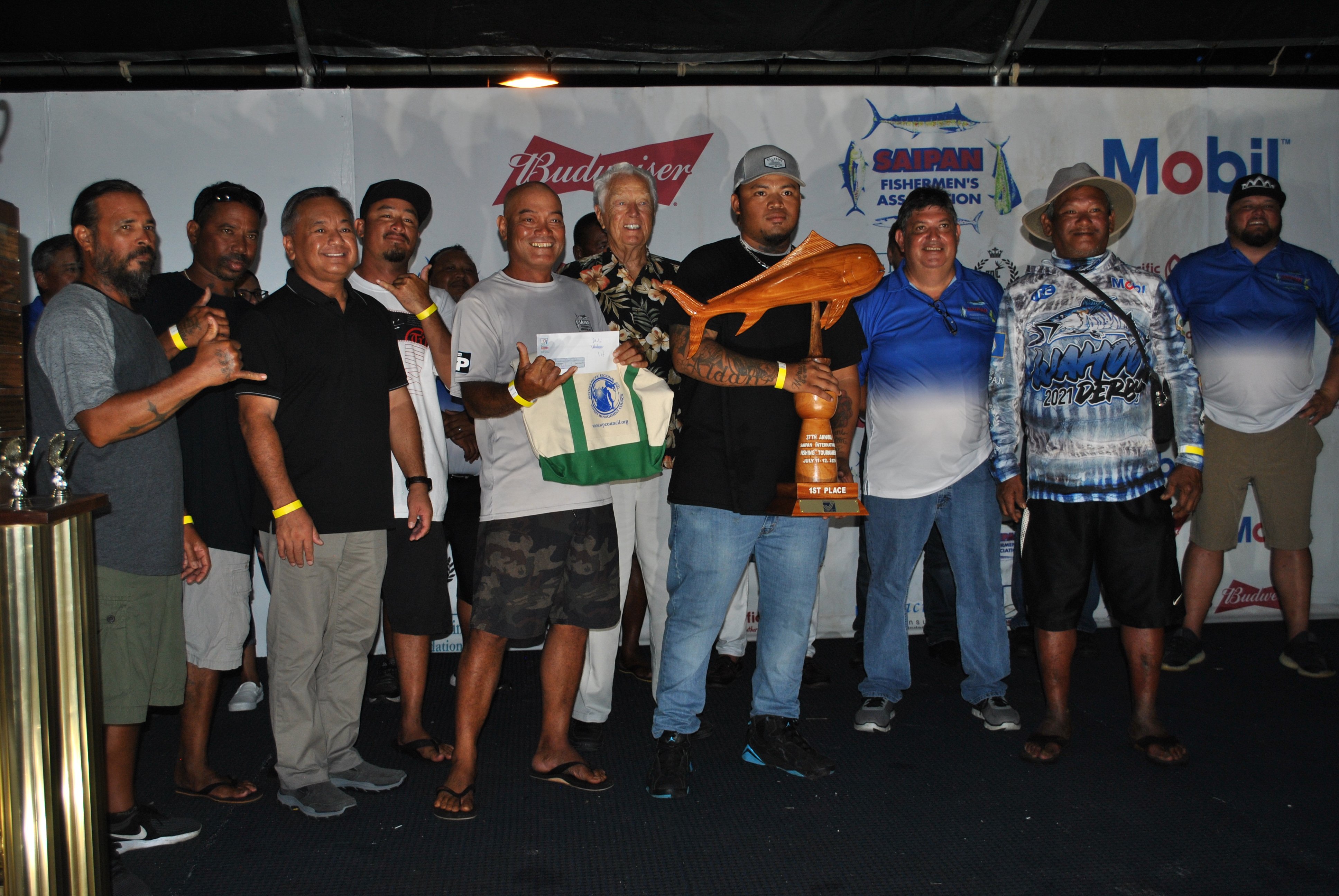 The Regulator crewmembers pose with the Mahi Mahi trophy.