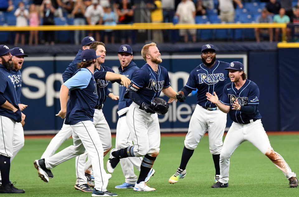 Tampa Bay Rays designated hitter Austin Meadows (17) celebrates with teammates after hitting a walk-off single in the ninth inning against the Baltimore Orioles at Tropicana Field in St. Petersburg, Florida on July 21, 2021.