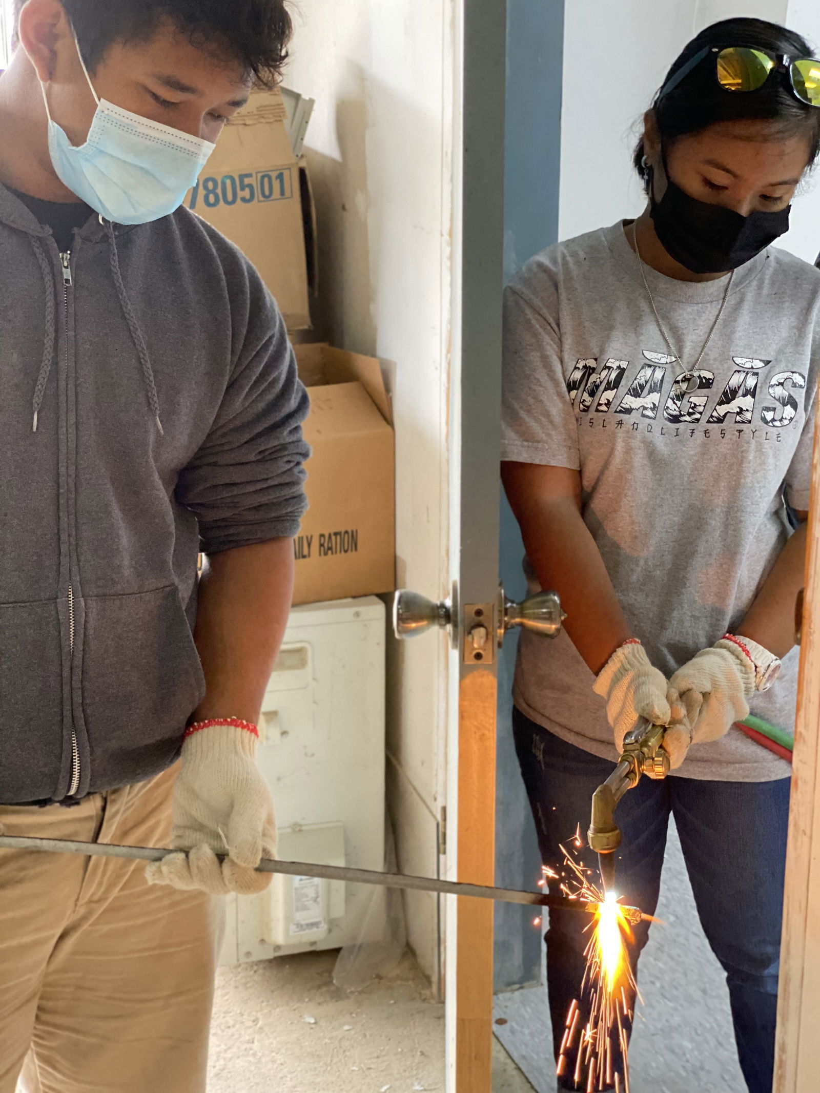 A student learns a basic welding skill.