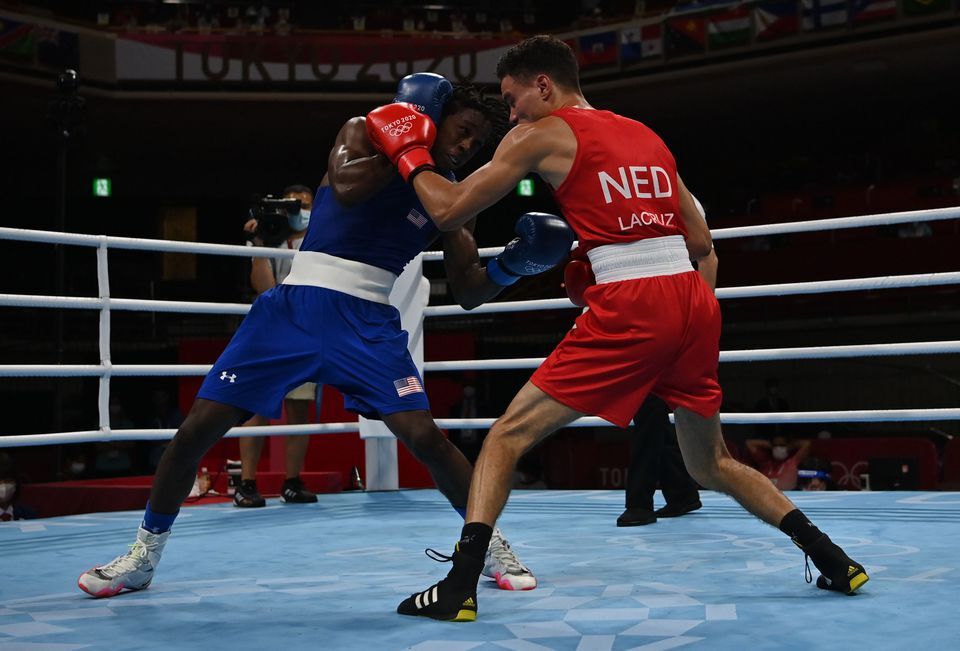 Enrico Lacruz of the Netherlands in boxing action against Keyshawn Davis of the United States in the men's lightweight division at the Tokyo Olympics in Tokyo, Japan on July 25, 2021.