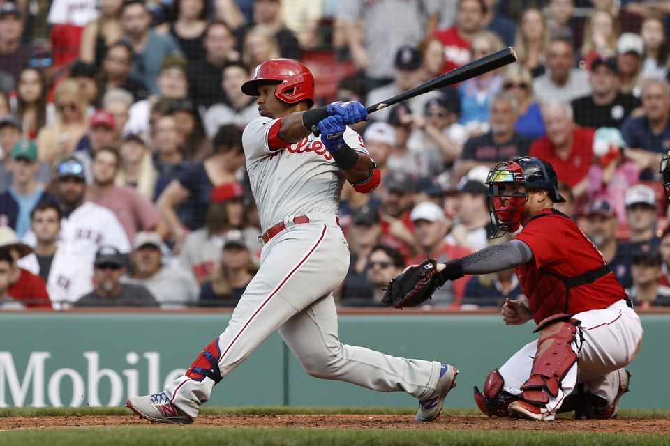 Philadelphia Phillies shortstop Jean Segura (2) hits a two run single against the Boston Red Sox during the eighth inning at Fenway Park in Boston on Saturday.