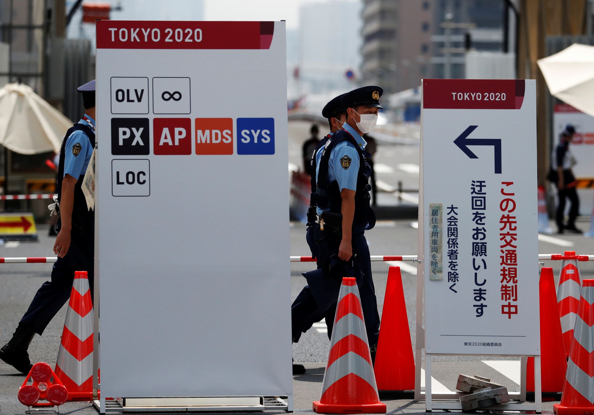 Police officers patrol at the entrance of the Athletes Village ahead of the Tokyo 2020 Olympic Games that have been postponed to 2021 due to the coronavirus disease pandemic, in Tokyo, Japan on July 13, 2021.