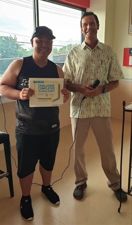 Second place men’s (30-49) Randolf Ferrer with Gold’s Gym general manager Tyce Mister. 