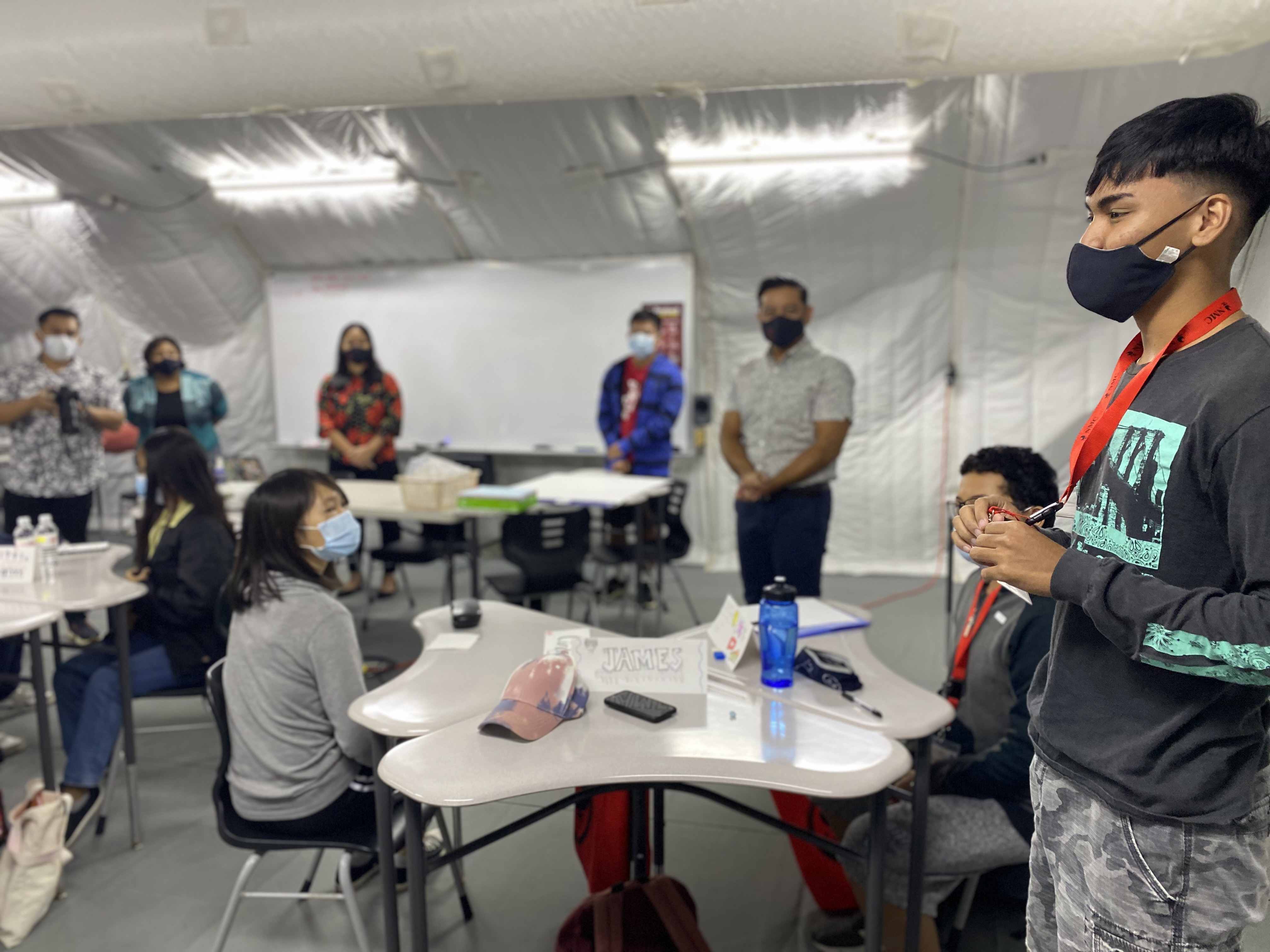 A student, right, shares his desire to pursue a teaching career.