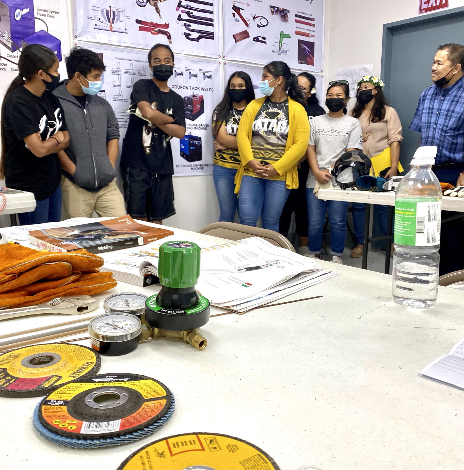 Commissioner of Education Dr. Alfred B. Ada and Tanapag Middle School principal Hilda Rios speak with students enrolled in the Northern Marianas Technical Institute Summer Program.
