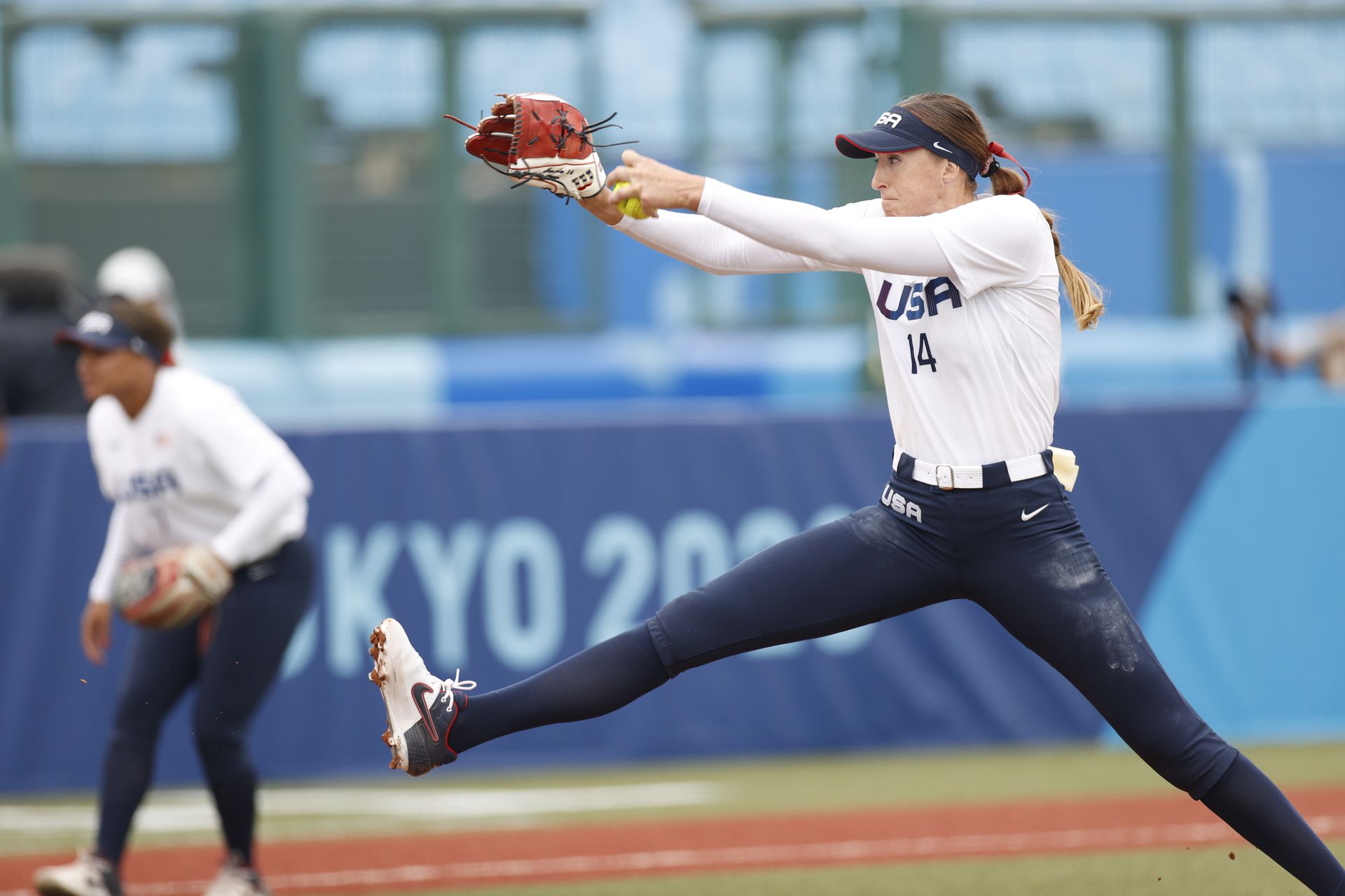 USA softball player Monica Abbott (14) delivers at pitch during the Tokyo 2020 Olympic Summer Games at Fukushima Azuma Stadium.