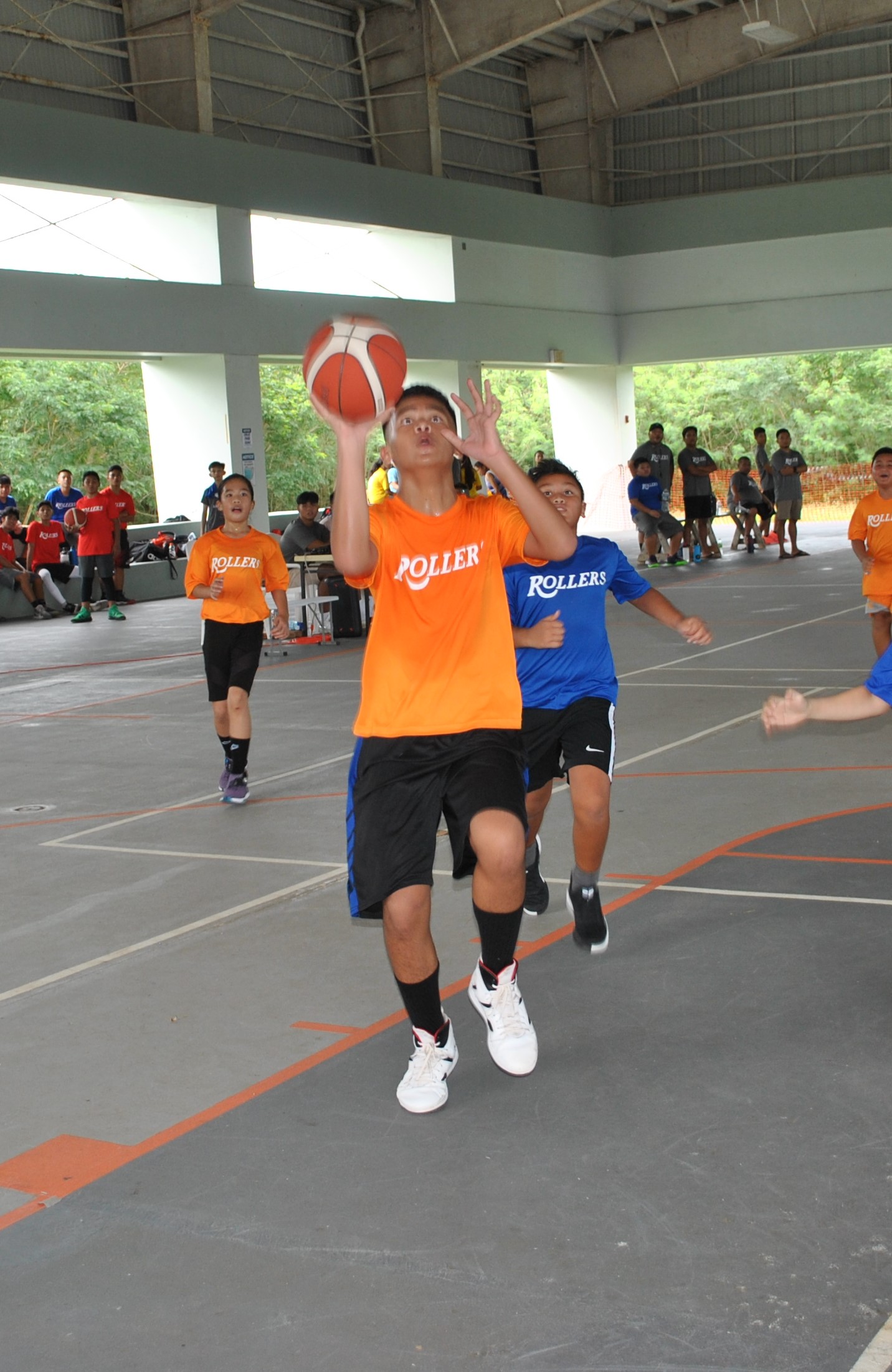 The Suns' Kobe takes the shot during the U12 division championship game of the 2021 NMI Rollers Summer Bash tournament on Sunday at the Koblerville gym.