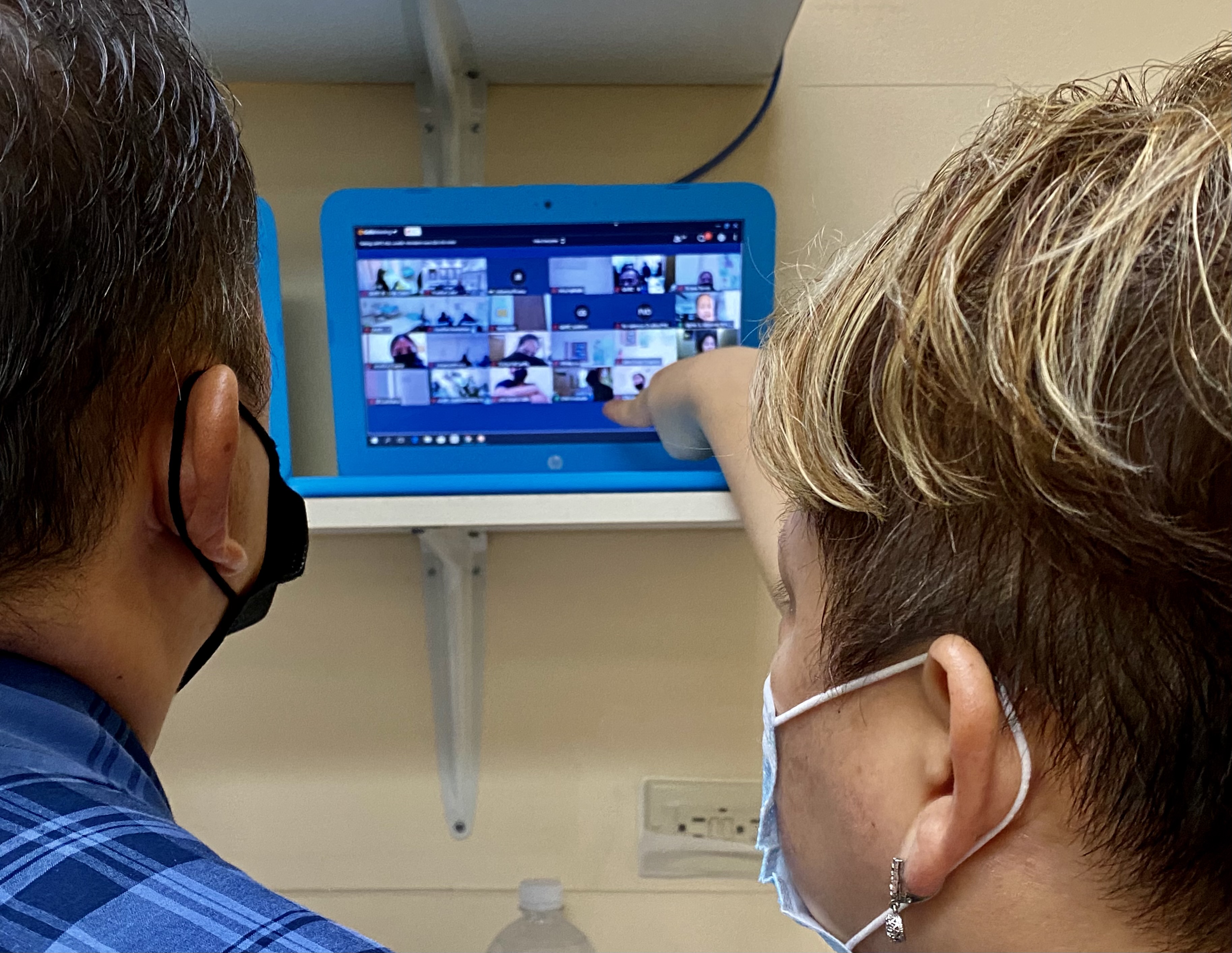 Public School System-Career and Technical Education Program Director Dr. Jessica B. Taylor explains to Commissioner of Education Dr. Alfred Ada how synchronous online training works.