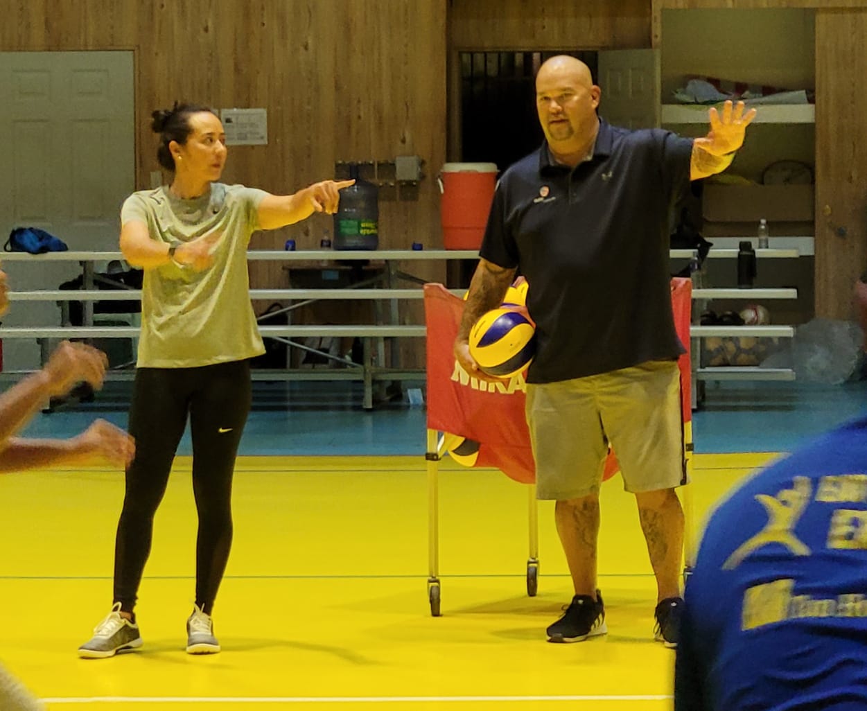 NMI Volleyball Association president Somia Quan and coach Mike Rabago share a few words with the volleyball clinic participants.
