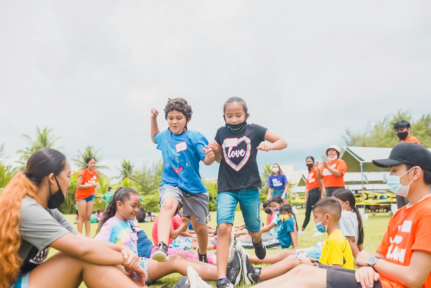 Campers from House of Taga challenge each other during a game of “Human Ladder.”
