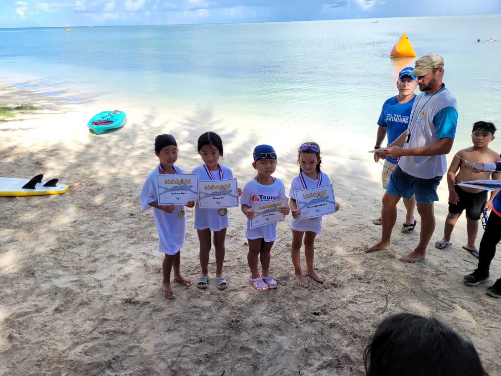 The girls of the 20m race in the Triple Crown Open Water Swim Series pose with their certificates and medals.