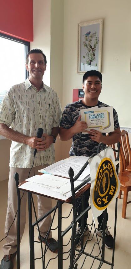 Third place men’s (18-29 Art Castillo with Gold’s Gym general manager Tyce Mister. 