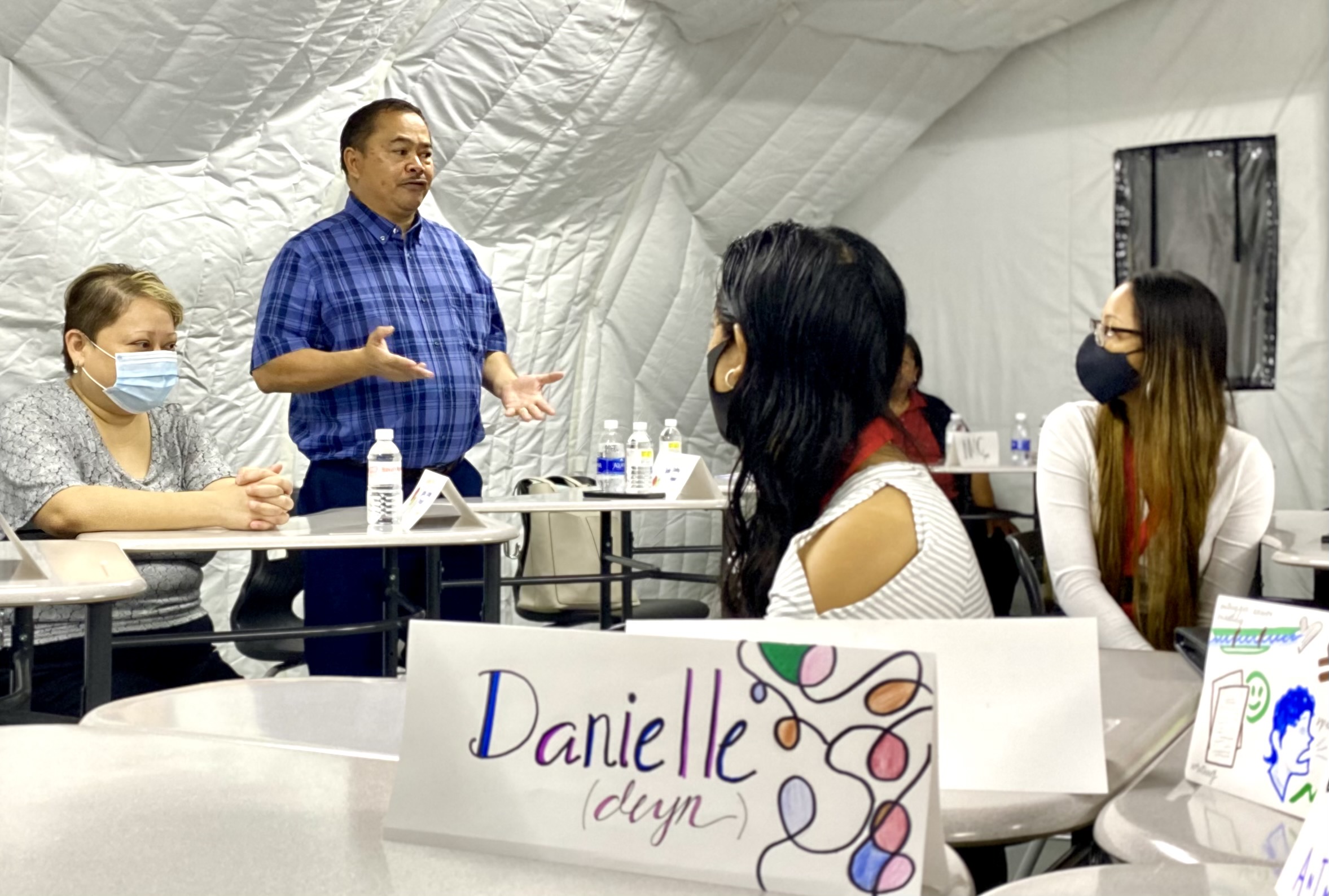 Commissioner of Education Dr. Alfred B. Ada talks about the importance of the Teacher Academy Program  which is being conducted by the Public School System-Career and Technical Education Program headed by Dr. Jessica Taylor, seated left.