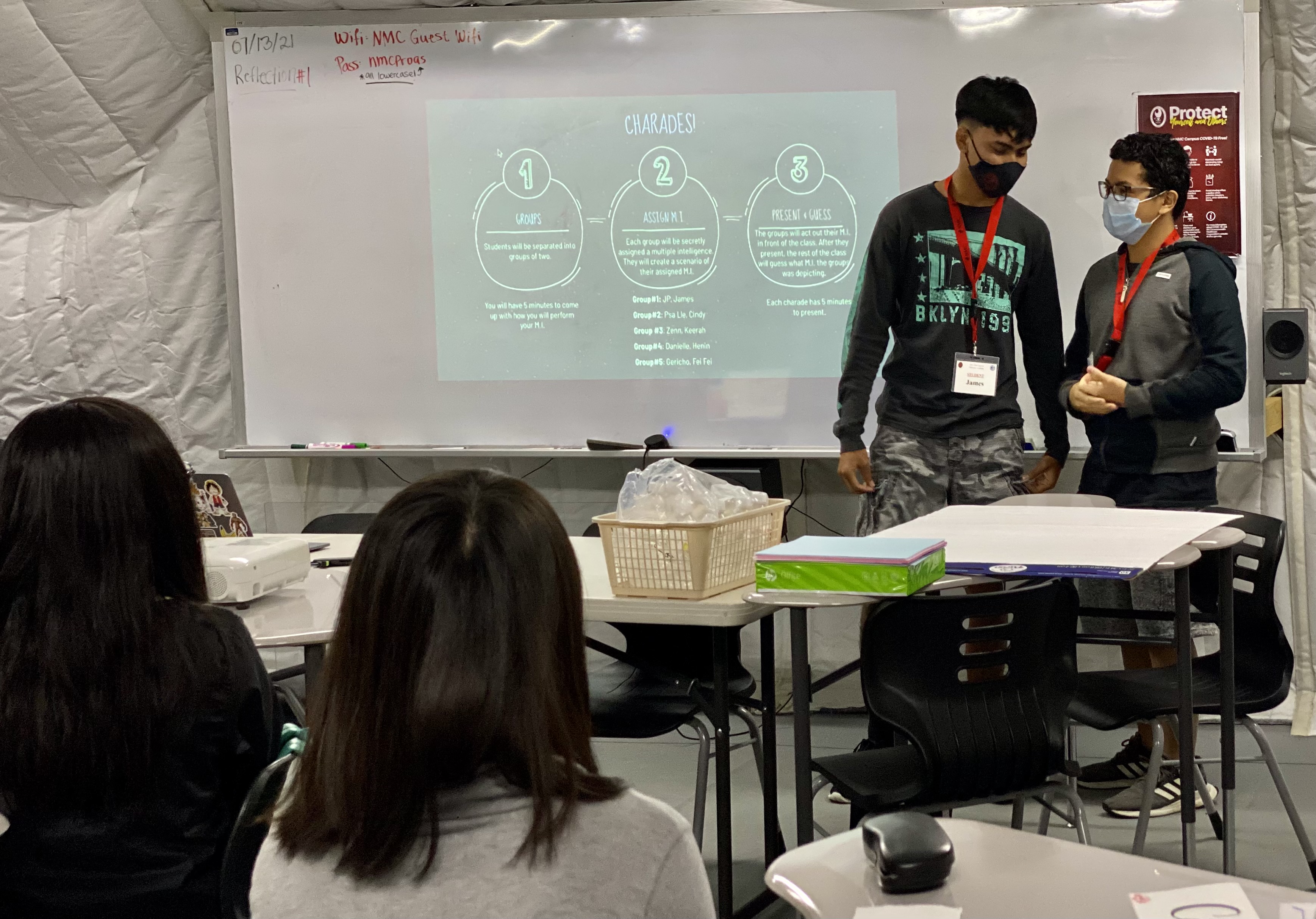 Two students give a presentation to their peers.