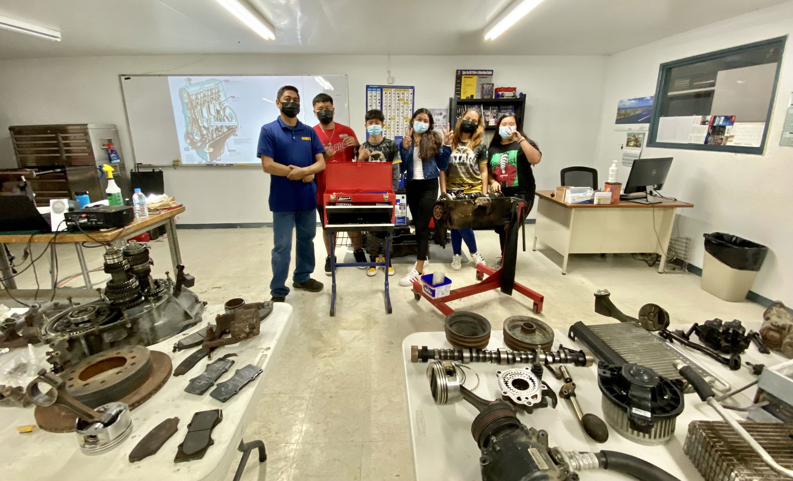 Students of the automotive class pose with their instructor, Dante Yumul.