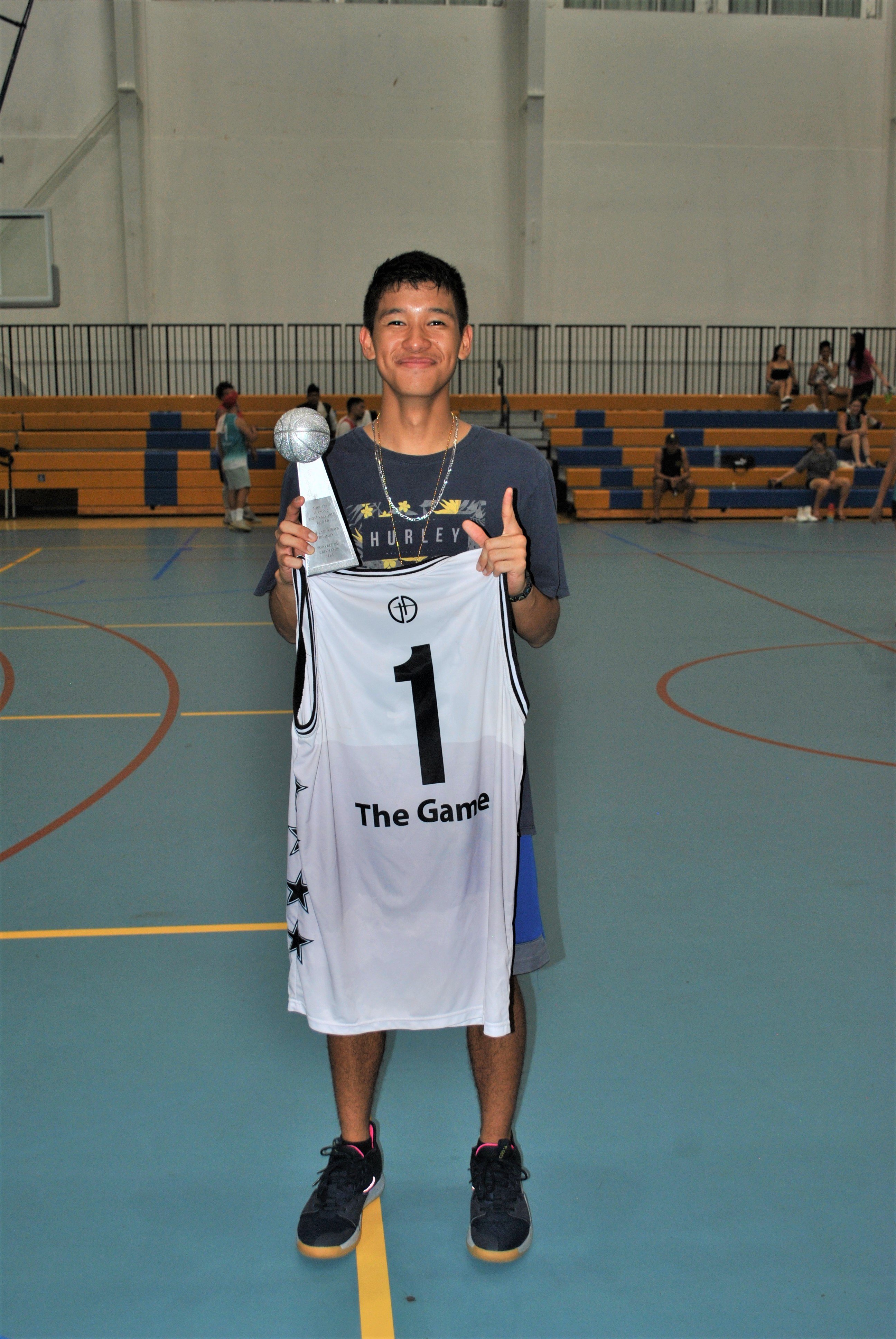 Leo Naraja of the Rollers poses with the MVP trophy.