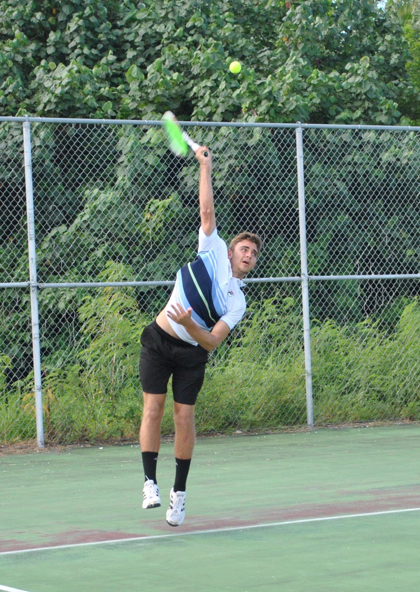 Colin Ramsey attempts the overhand serve.