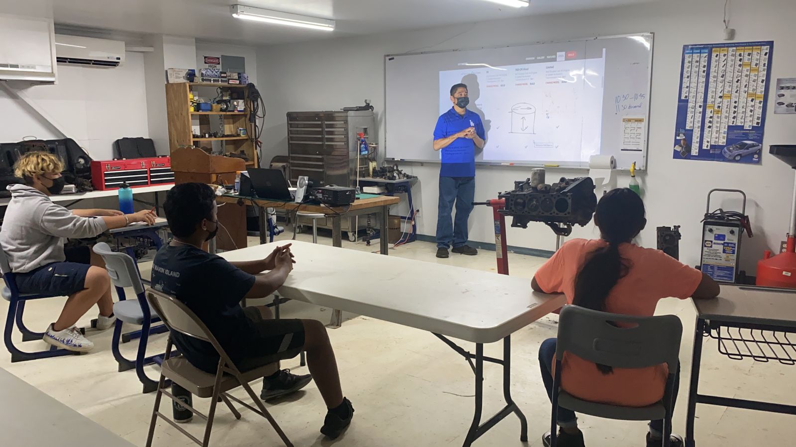 Students attend an introduction to automotive class.