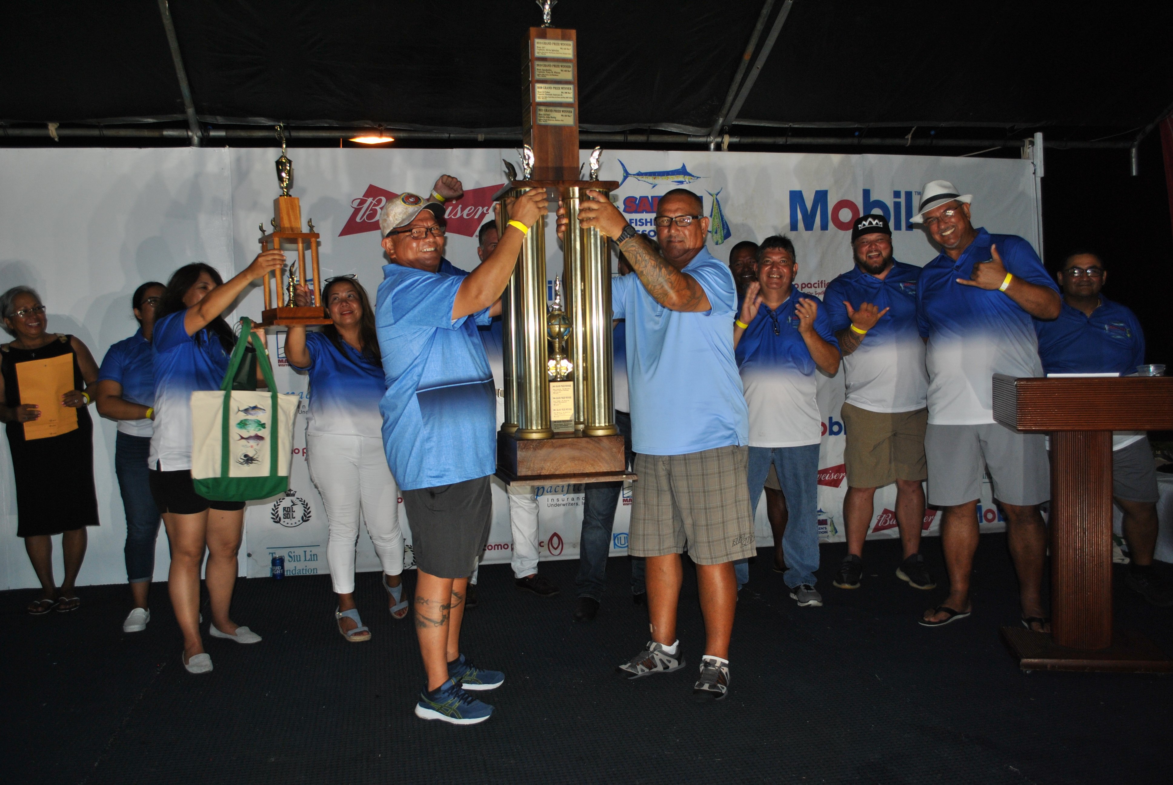 Da'Net's John Hattig and Frank Benavente carry the perpetual trophy  after topping the 37th Saipan International Fishing Tournament.