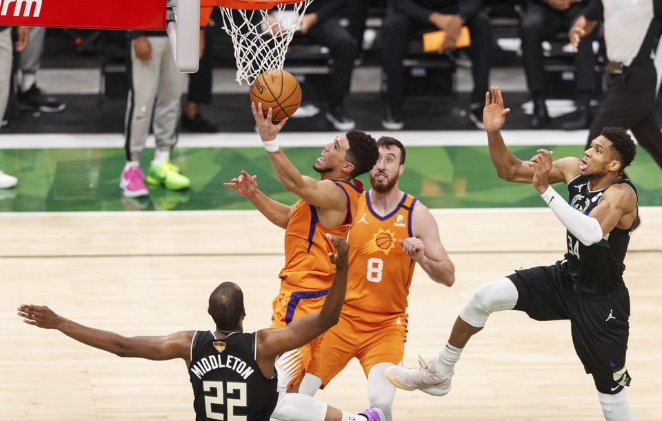 Phoenix Suns guard Devin Booker (1) shoots during the third quarter against the Milwaukee Bucks during game six of the 2021 NBA Finals at Fiserv Forum in Milwaukee, Wisconsin on July 20, 2021.