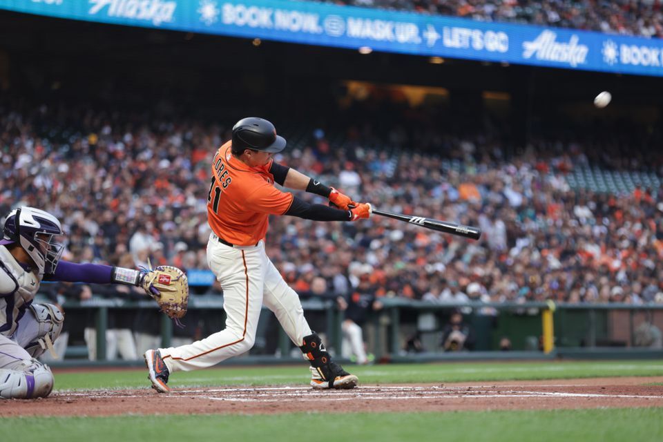 San Francisco Giants second baseman Wilmer Flores (41) hits a three run home run during the first inning against the Colorado Rockies at Oracle Park in San Francisco, California on Friday.