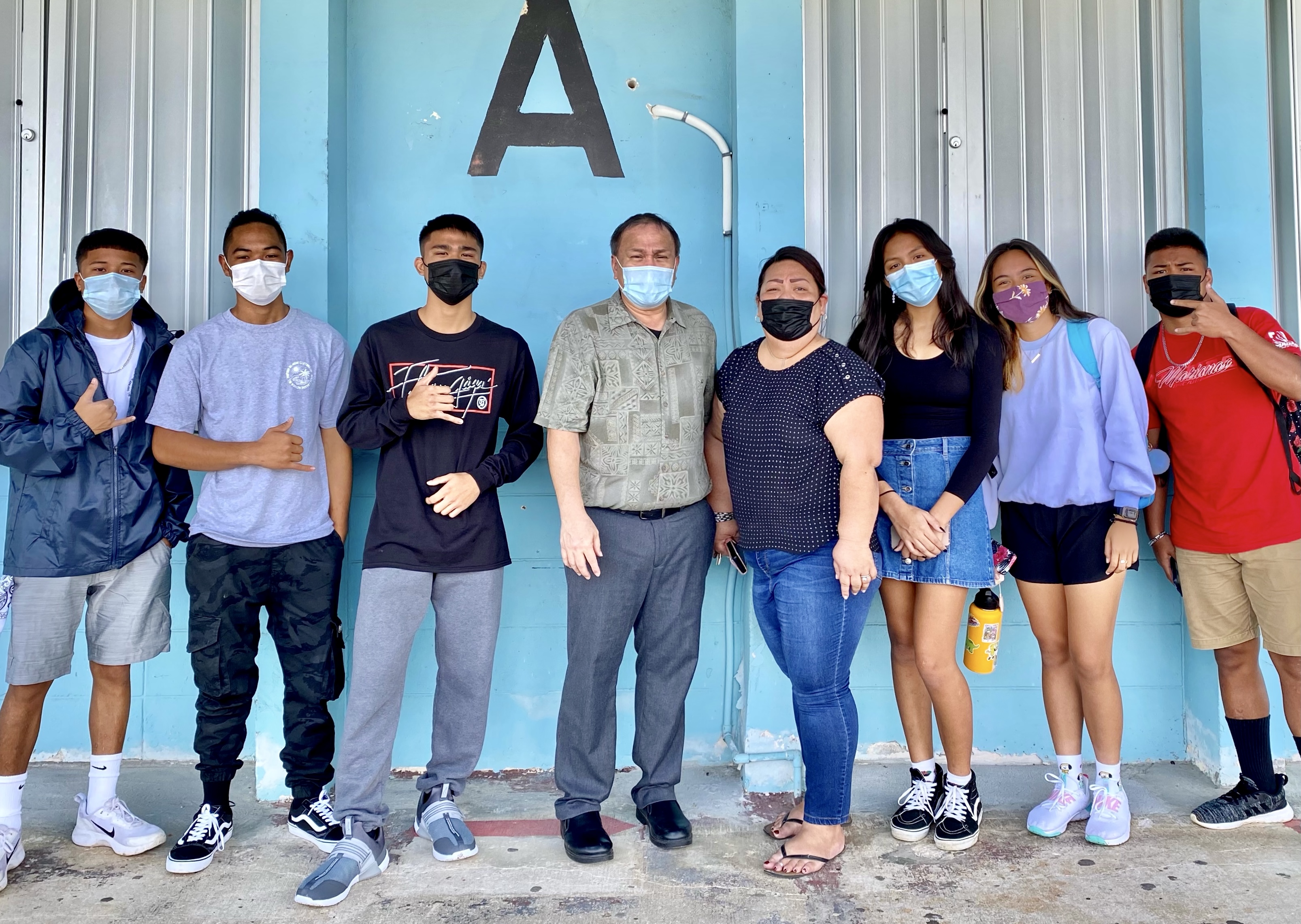 Board of Education Chairman Andrew L. Orsini, center, and Marianas High School vice principal Melanie Rdiall with students Lushawn Reyes Jr., Zarren Cruz, Justice Aldan, Adriana Tamparong, Raina Avelina and Tilyoram Kileleman.