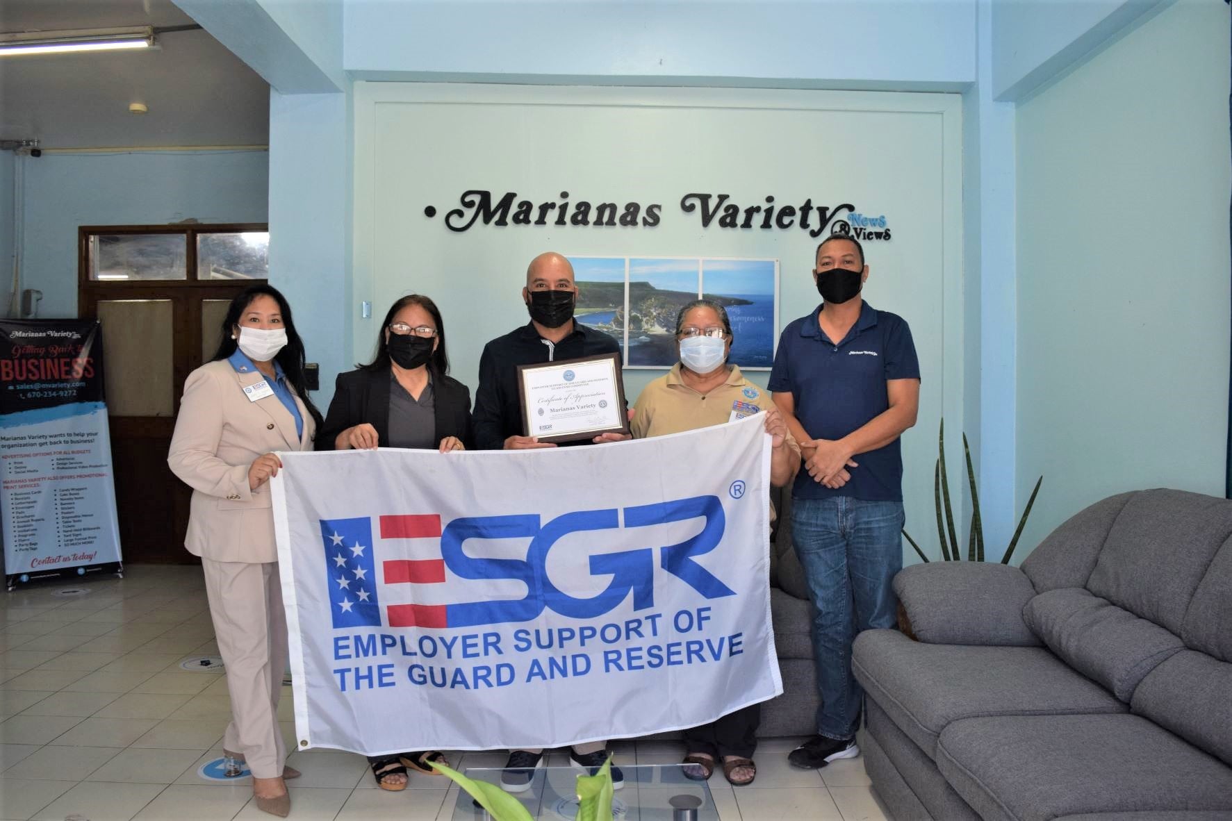Marianas Variety president Amier C. Younis, center, holds a Certificate of Appreciation that was presented at the MV office by Employer Support of the Guard and Reserve Guam-CNMI State Committee area chair Rita A. Sablan, Ed.D, second left, ESGR CNMI ombudsman Joann T. Aquino, left, and ESGR area chair emeritus and employer outreach coordinator Rose Igitol, 2nd right. Also in the photo is MV reporter Emmanuel “Arnold” T. Erediano, right.
